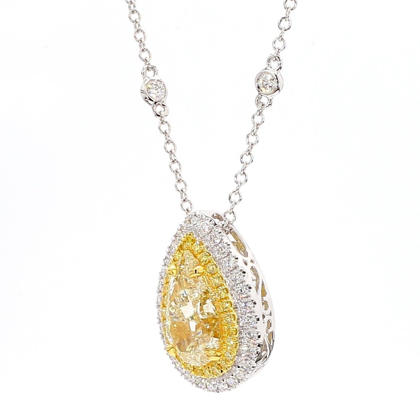 RareGemWorld's beautiful diamond pendant. Mounted in a beautiful 18K Yellow and White Gold setting with a natural pear cut yellow diamond. The yellow diamond is surrounded by round natural white diamond melee and round natural yellow diamond melee.