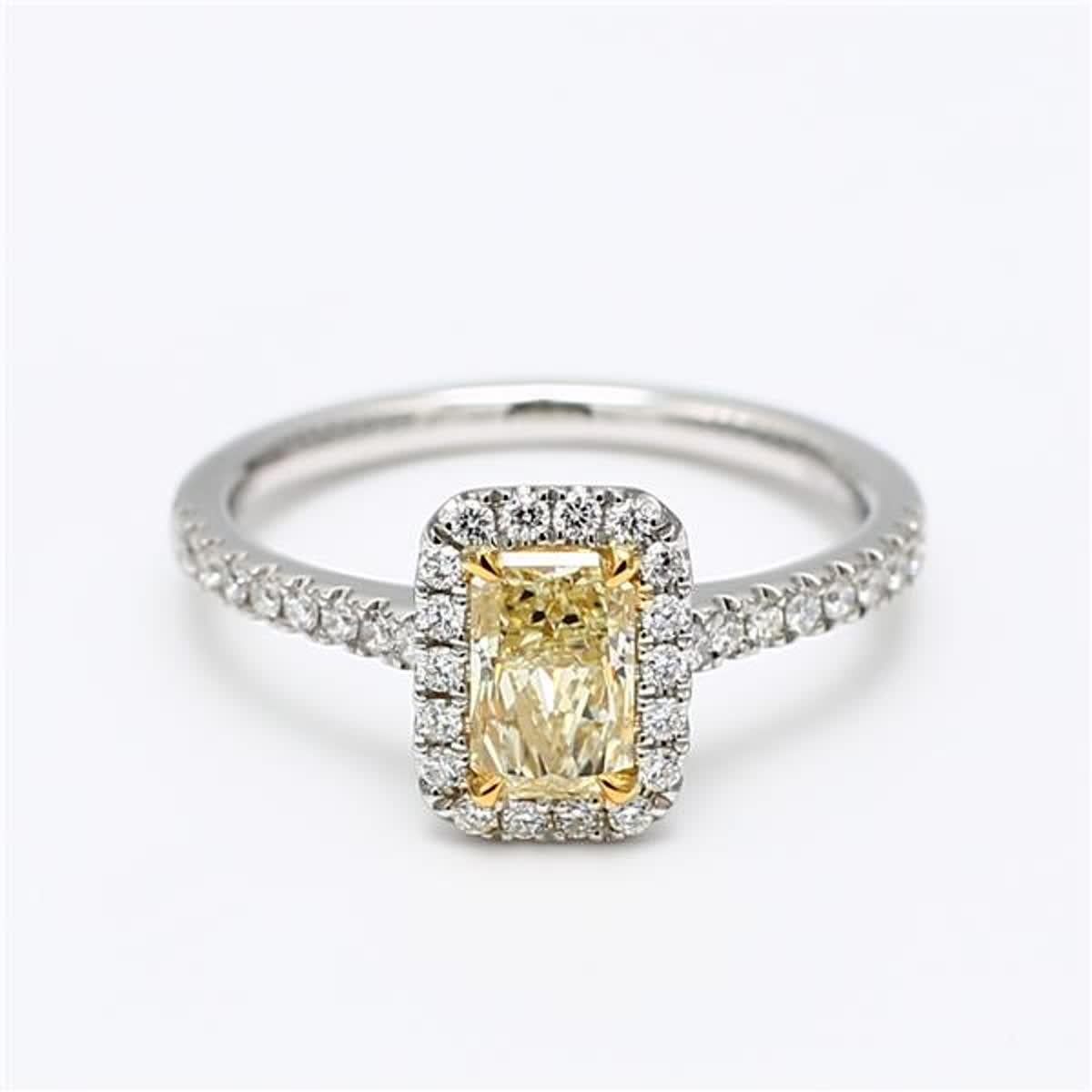 RareGemWorld's classic GIA certified diamond ring. Mounted in a beautiful 18K Yellow and White Gold and Platinum setting with a natural radiant cut yellow diamond. The yellow diamond is surrounded by small round natural white diamond melee. This