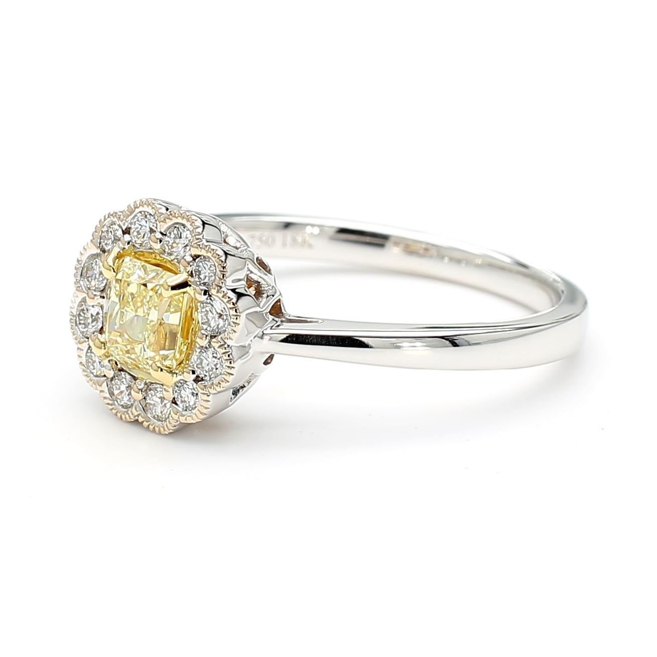 RareGemWorld's beautiful GIA certified diamond ring. Mounted in a beautiful 18K Yellow and White Gold setting with a natural radiant cut yellow diamond. The yellow diamond is surrounded by round natural white diamond melee. This ring is guaranteed