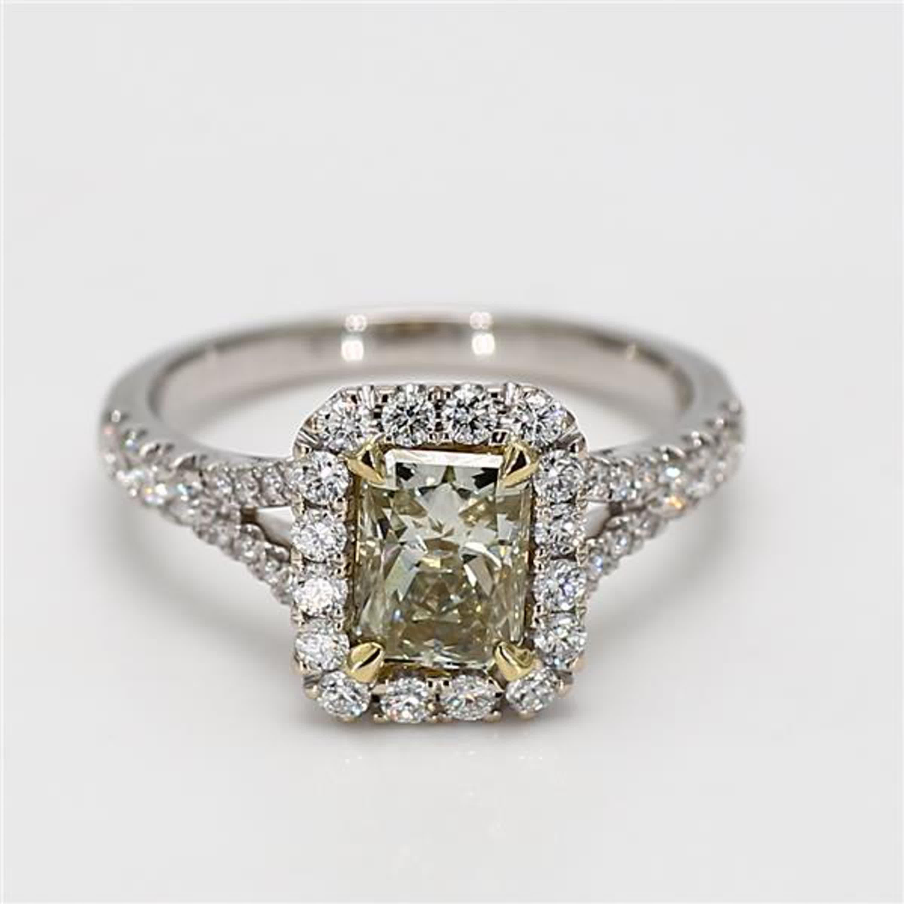 RareGemWorld's classic GIA certified diamond ring. Mounted in a beautiful 18K Yellow and White Gold setting with a natural radiant cut yellow diamond. The yellow diamond is surrounded by small round natural white diamond melee. This ring is