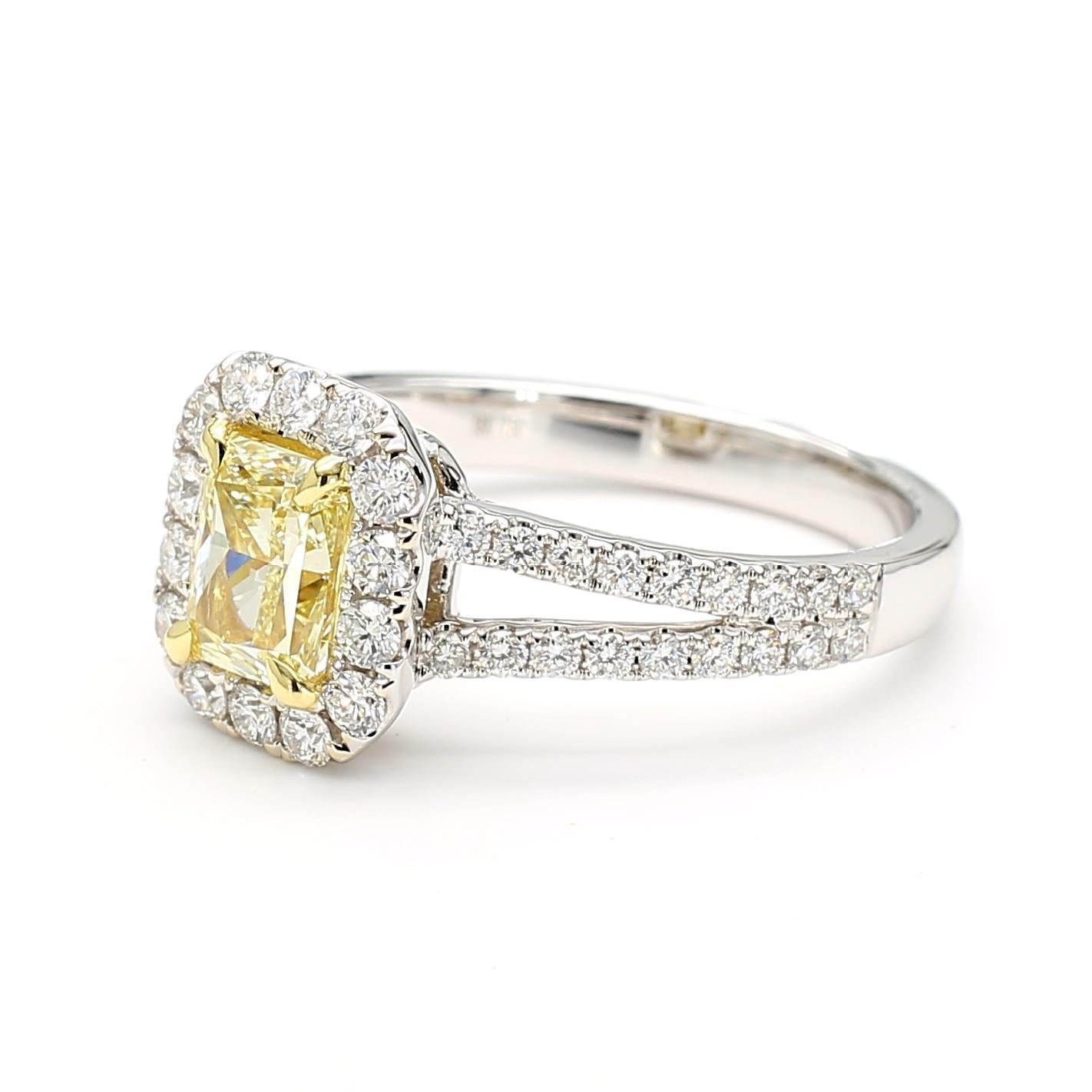 RareGemWorld's beautiful GIA certified diamond ring. Mounted in a beautiful 18K Yellow and White Gold setting with a natural radiant cut yellow diamond. The yellow diamond is surrounded by round natural white diamond melee. This ring is guaranteed