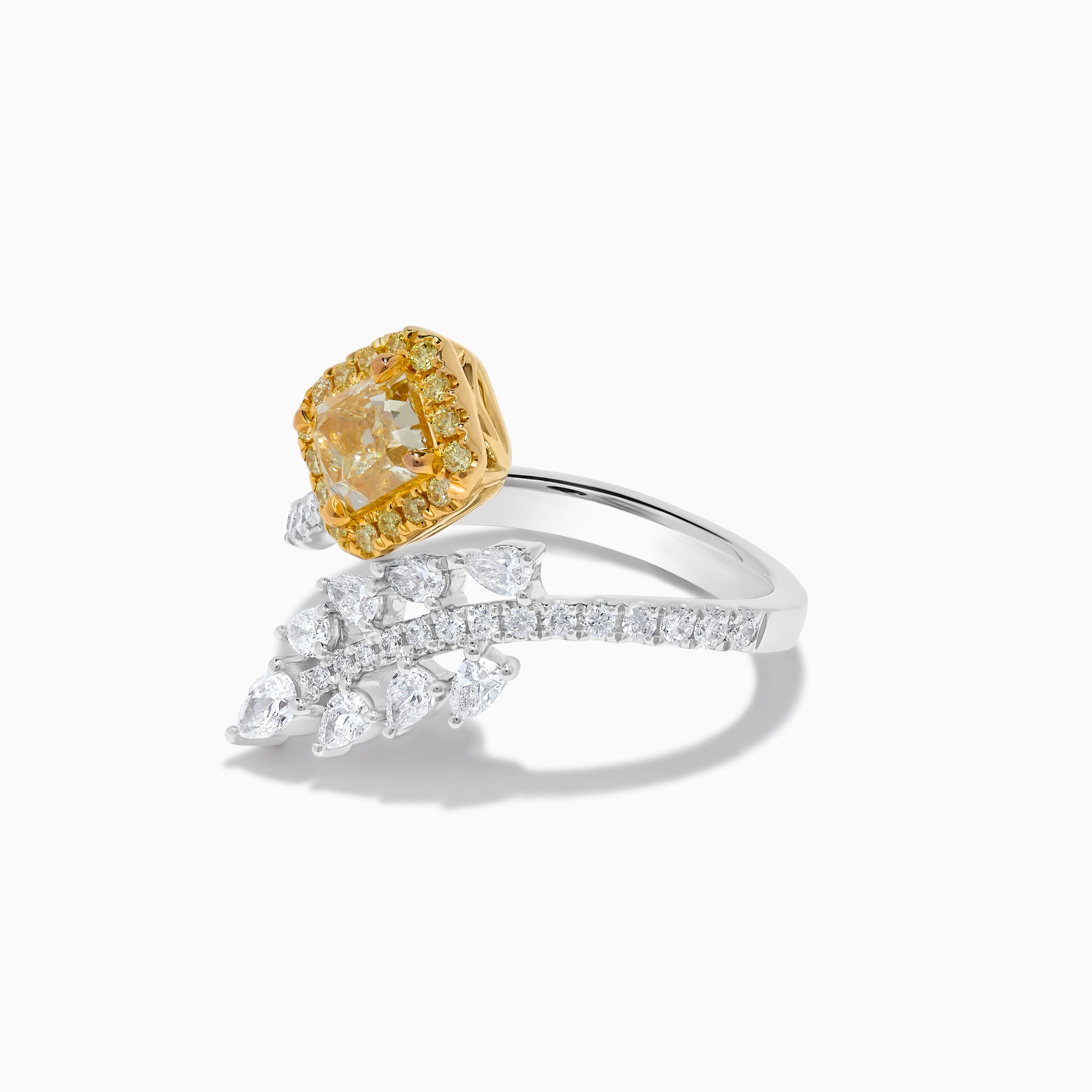 RareGemWorld's classic GIA certified diamond ring. Mounted in a beautiful 18K Yellow and White Gold setting with a natural radiant cut yellow diamond. The yellow diamond is surrounded by natural pear cut white diamonds, round natural yellow diamond
