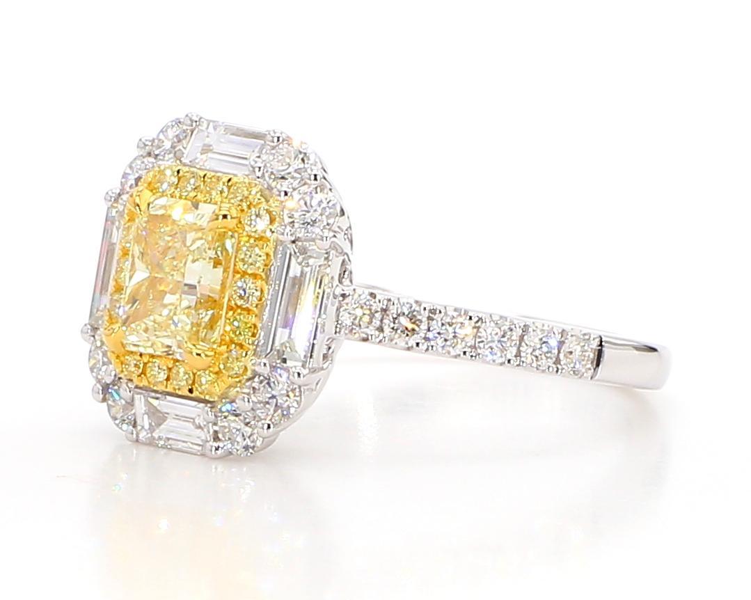 RareGemWorld's beautiful diamond ring. Mounted in a beautiful 18K Yellow and White Gold setting with a natural radiant cut yellow diamond. The yellow diamond is surrounded by natural baguette cut white diamonds and round natural white diamond melee.