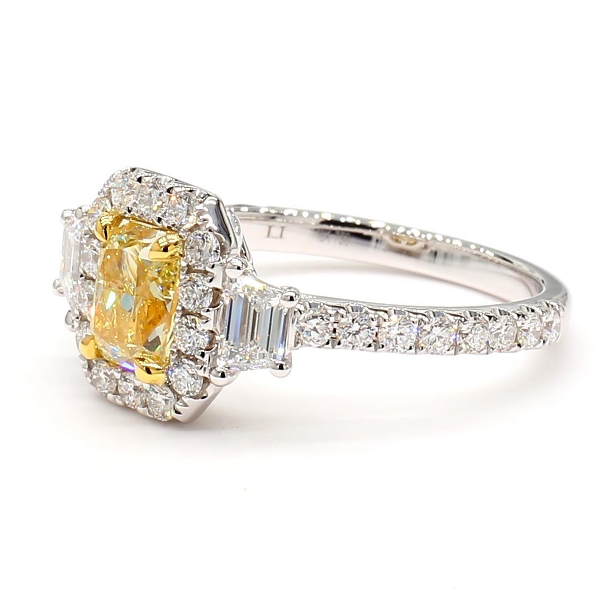RareGemWorld's beautiful diamond ring. Mounted in a beautiful 18K Yellow and White Gold setting with a natural radiant cut yellow diamond. The yellow diamond is surrounded by two natural trapezoid cut white diamonds and round natural white diamond