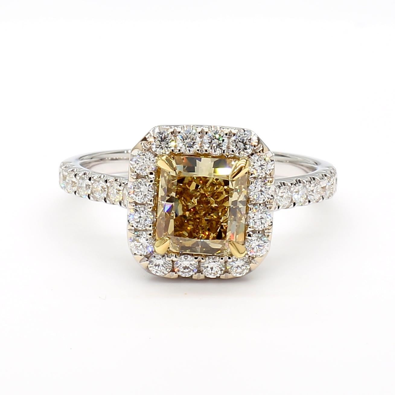 RareGemWorld's beautiful GIA certified diamond ring. Mounted in a beautiful 18K Yellow and White Gold setting with a natural radiant cut Fancy Brownish Yellow diamond. The diamond is surrounded by round natural white diamond melee. This ring is