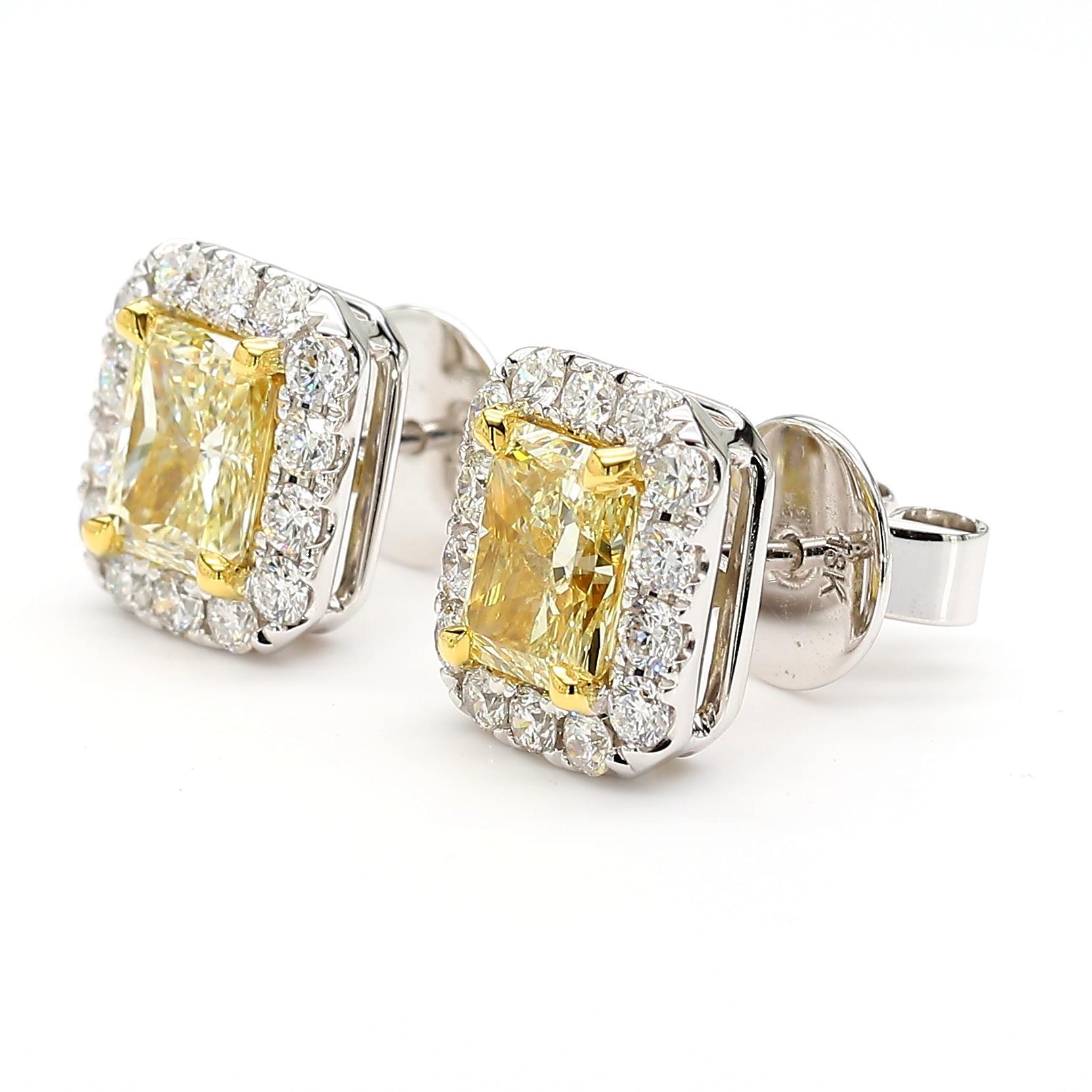 RareGemWorld's beautiful GIA certified diamond earrings. Mounted in a beautiful 18K Yellow and White Gold setting with natural radiant cut yellow diamonds. The yellow diamonds are surrounded by round natural white diamond melee. These earrings are
