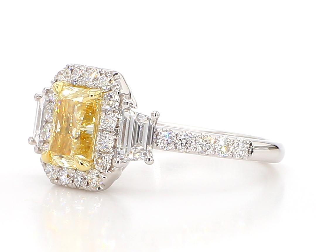 RareGemWorld's classic diamond ring. Mounted in a beautiful 18K Yellow and White Gold setting with a natural radiant cut yellow diamond. The yellow diamond is surrounded by two GIA certified natural taper baguette cut white diamonds and round