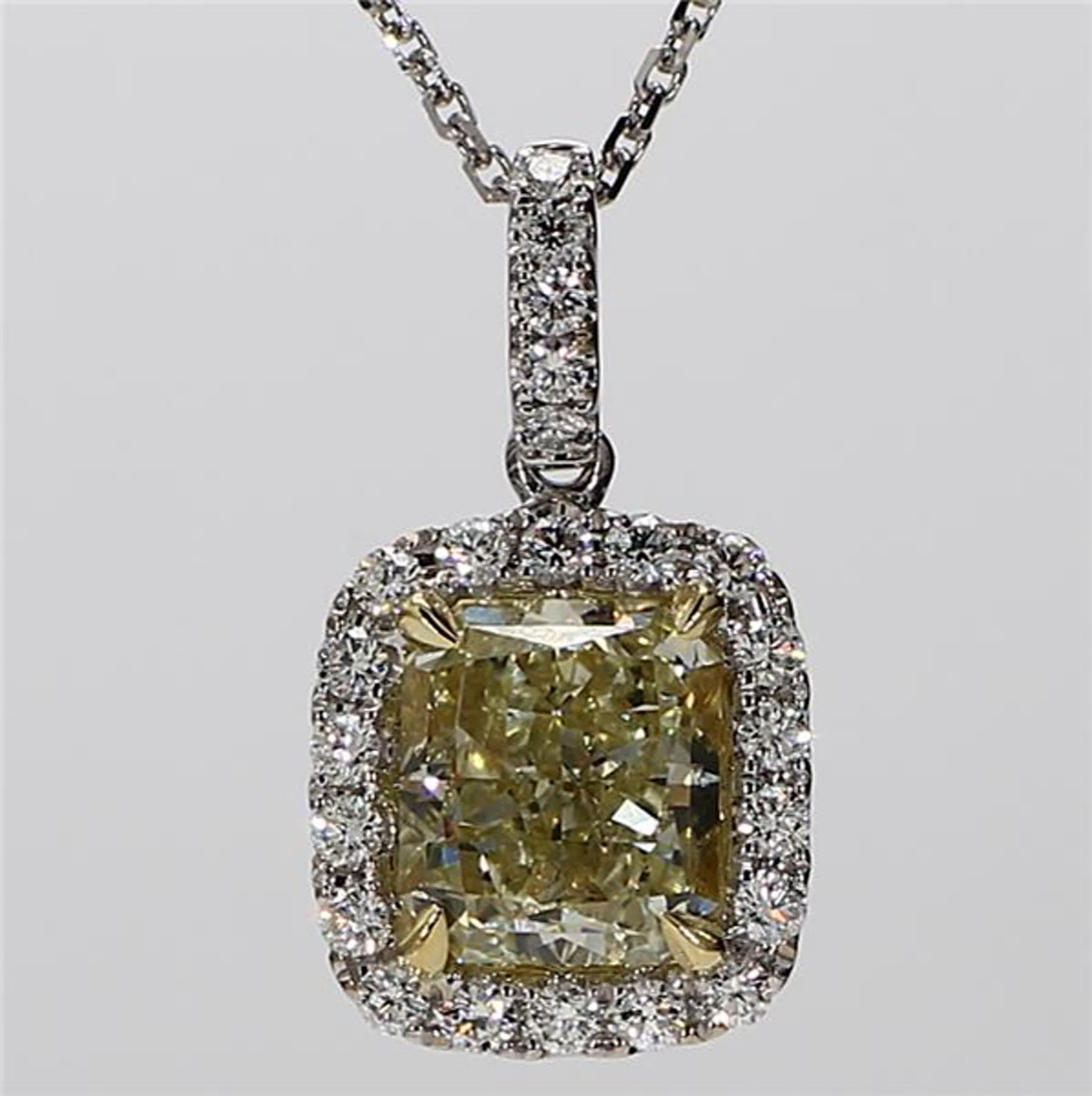 RareGemWorld's classic GIA certified diamond pendant. Mounted in a beautiful 18K Yellow and White Gold setting with natural radiant cut yellow diamonds. The yellow diamonds are surrounded by round natural white diamond melee. This necklace is