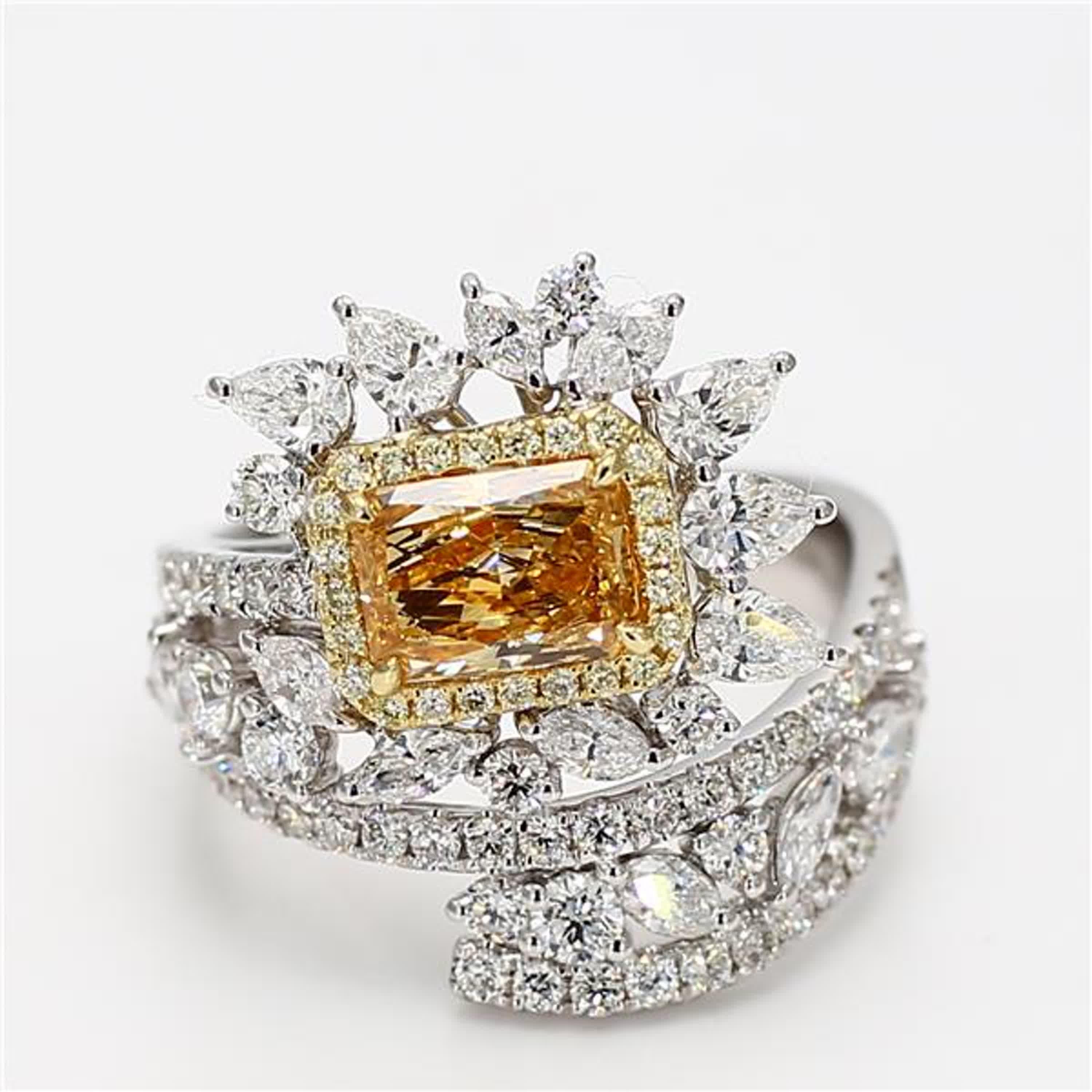 RareGemWorld's classic GIA certified diamond ring. Mounted in a beautiful 18K Yellow and White Gold and Platinum setting with a natural radiant cut yellow diamond. The yellow diamond is surrounded by natural marquise cut white diamonds, natural