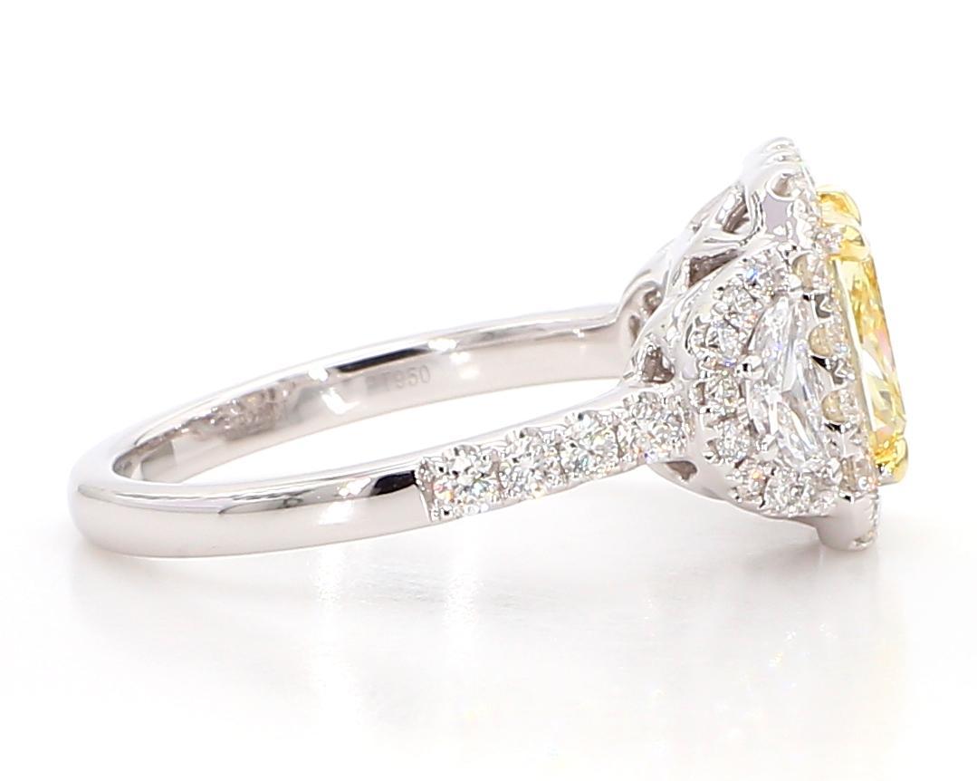 RareGemWorld's beautiful diamond ring. Mounted in a beautiful Platinum and 18K Gold setting with a natural radiant cut yellow diamond. The yellow diamond is surrounded by two GIA certified natural half moon cut white diamonds and round natural white