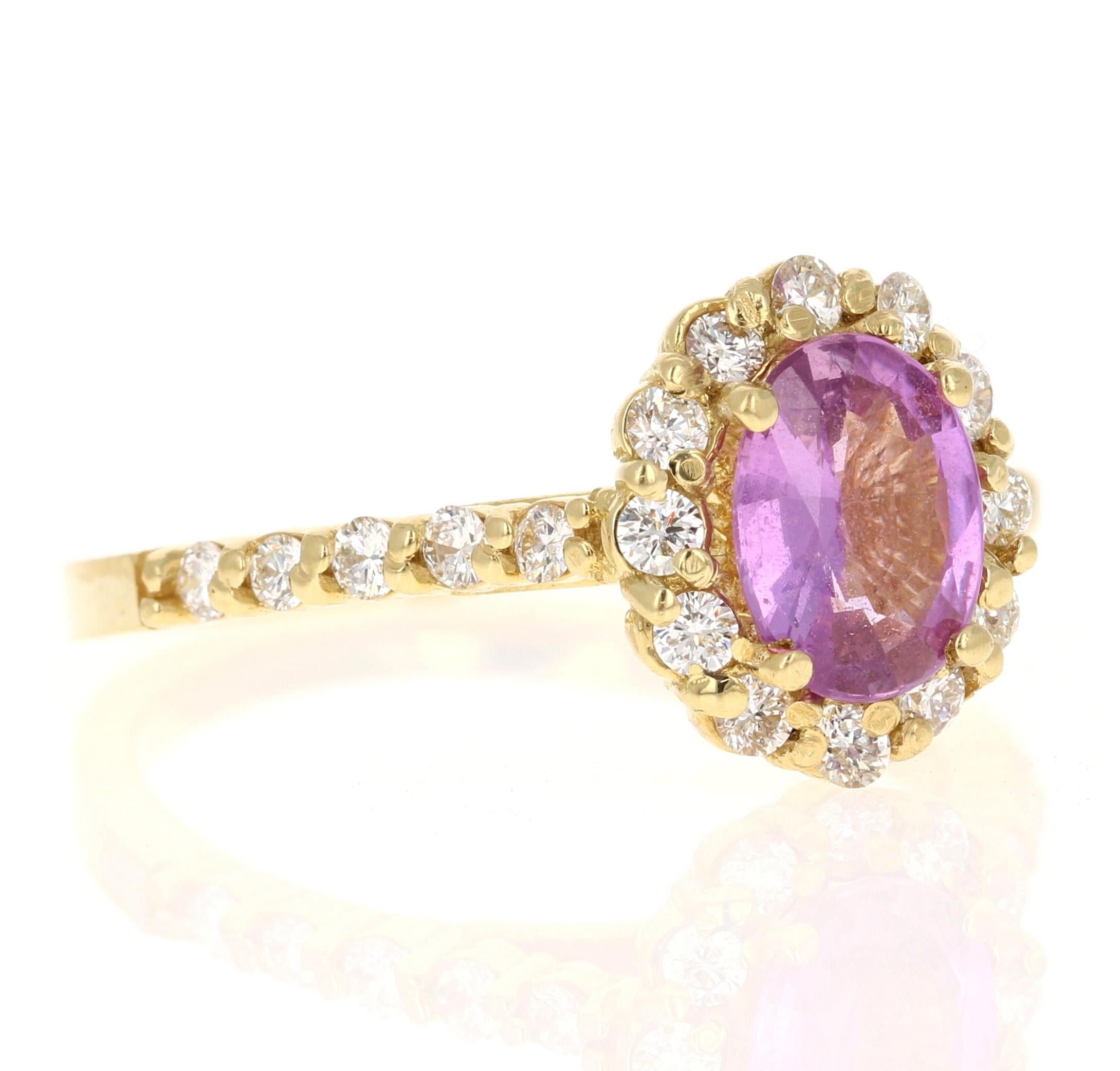 This beautiful ring has a Natural No Heat Oval Cut Pink Sapphire that weights 1.11 Carats and measures at 8 mm x 6 mm.

The ring is embellished with 24 Round Cut Diamonds that weigh 0.52 Carats with a clarity and color of VS/H. The total carat