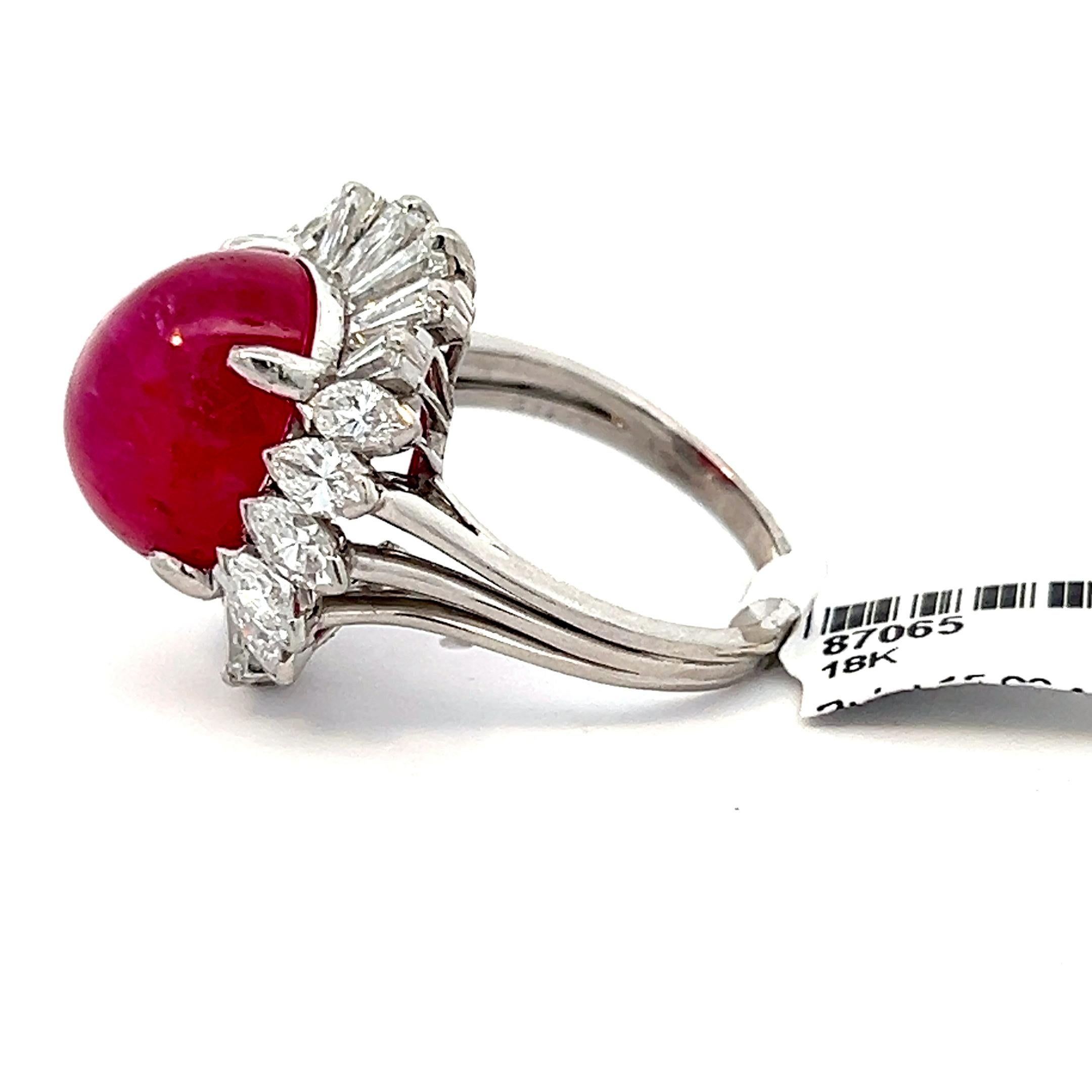 GIA-Certified No Heat Afghanistan Ruby Diamond Ring. Discover the allure of timeless elegance with this stunning GIA-certified cocktail ring, showcasing a rare, untreated purplish-red ruby and sparkling diamonds in a ballerina-style setting. 
This