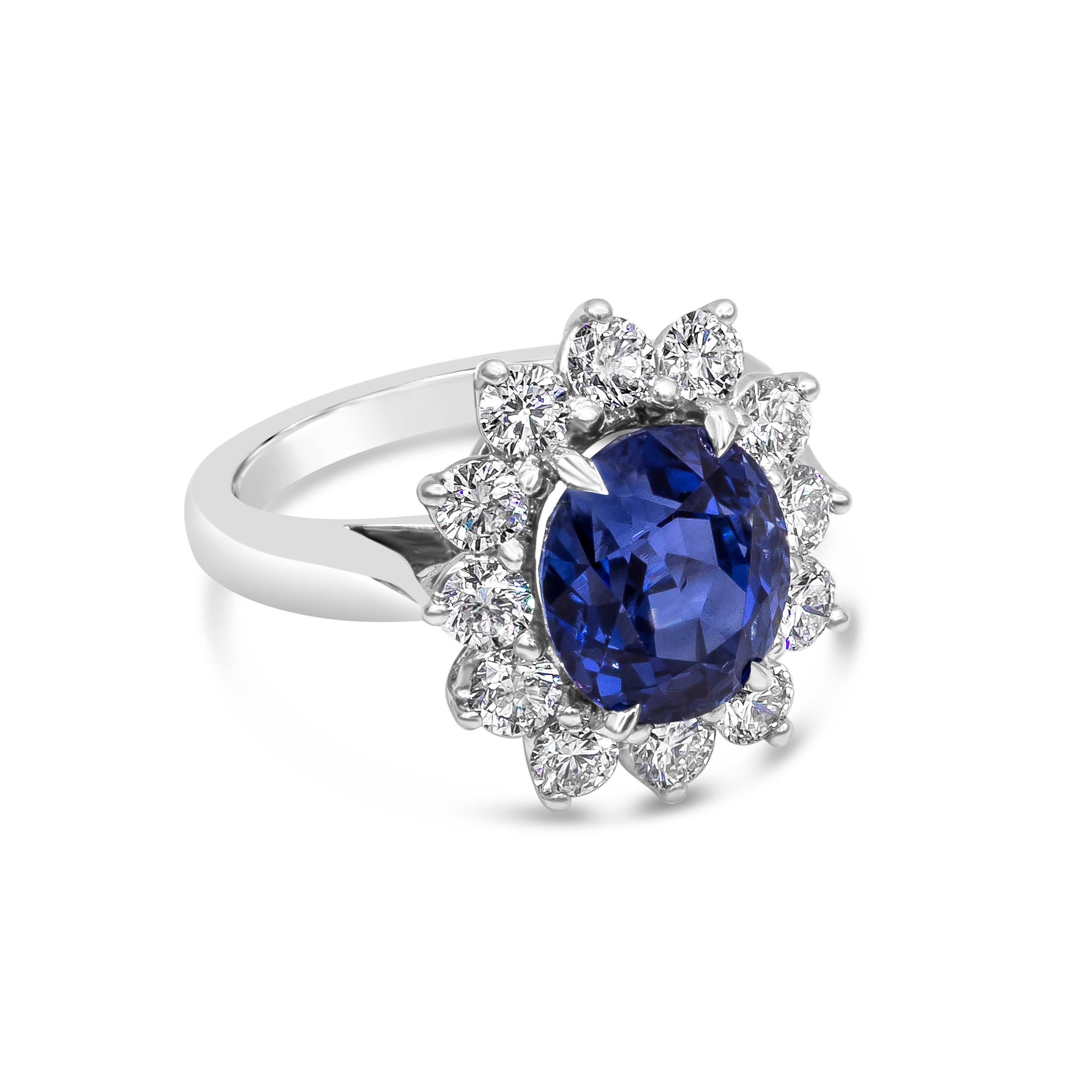 A color-rich piece of jewelry showcasing a rare oval cut 5.00 carat blue sapphire certified by GIA as natural with no indications of heat treatment. Surrounding the sapphire is a row of 12 round brilliant diamonds weighing 1.30 carats total, in a