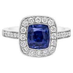 Bague de fiançailles Roman Malakov en saphir bleu non chauffé et halo de diamants