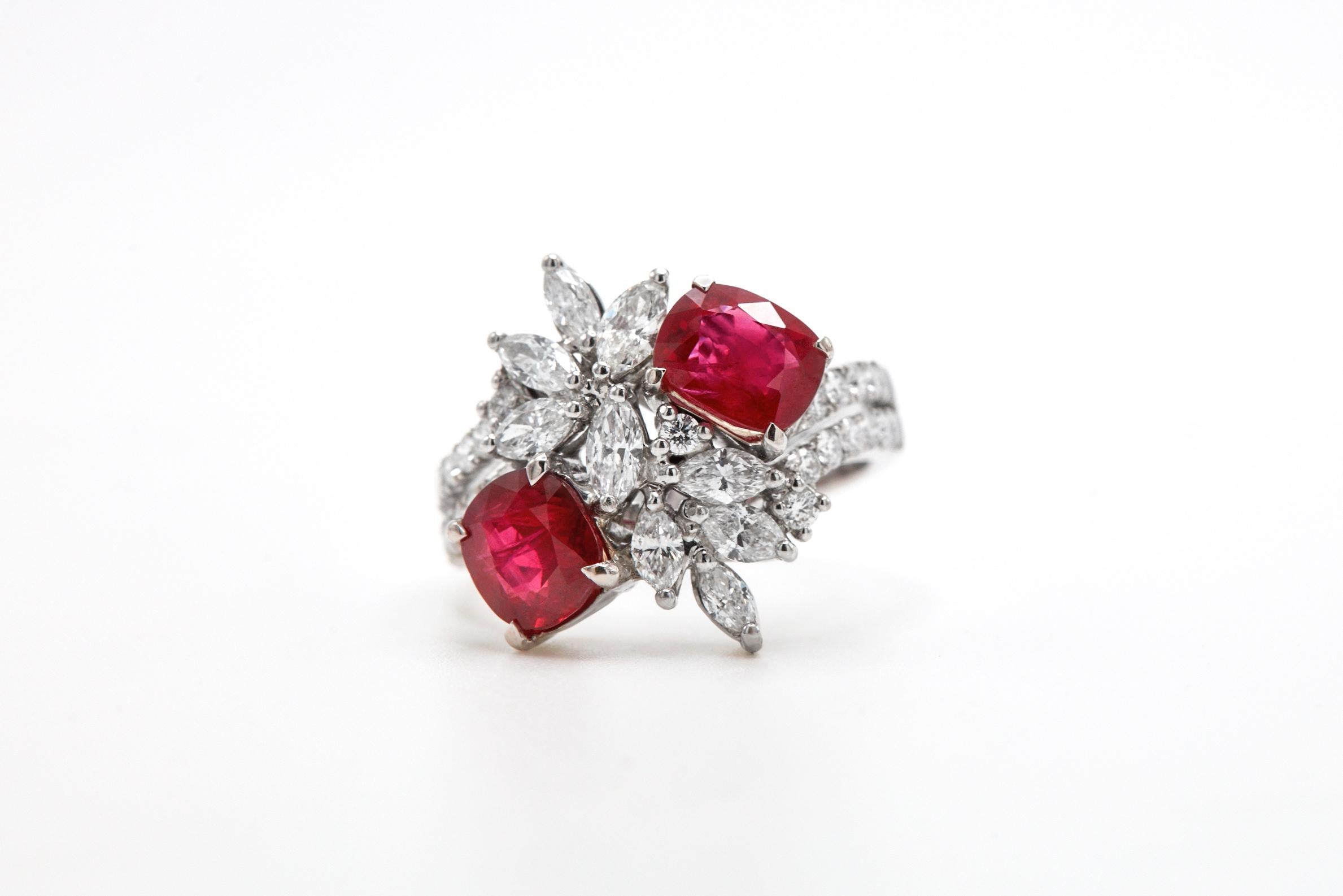 18K WHITE GOLD
26 ROUND DIAMONDS, 0.47 CARATS
10 MARQUIS DIAMONDS, 0.81 CARATS
2 NO HEAT PIGEON BLOOD RUBIES, 1.30 CT & 1.07 CT
GIA LAB CERTIFIED 

Introducing our exquisite Floral Toi et Moi Ring, a stunning blend of nature's beauty and dazzling