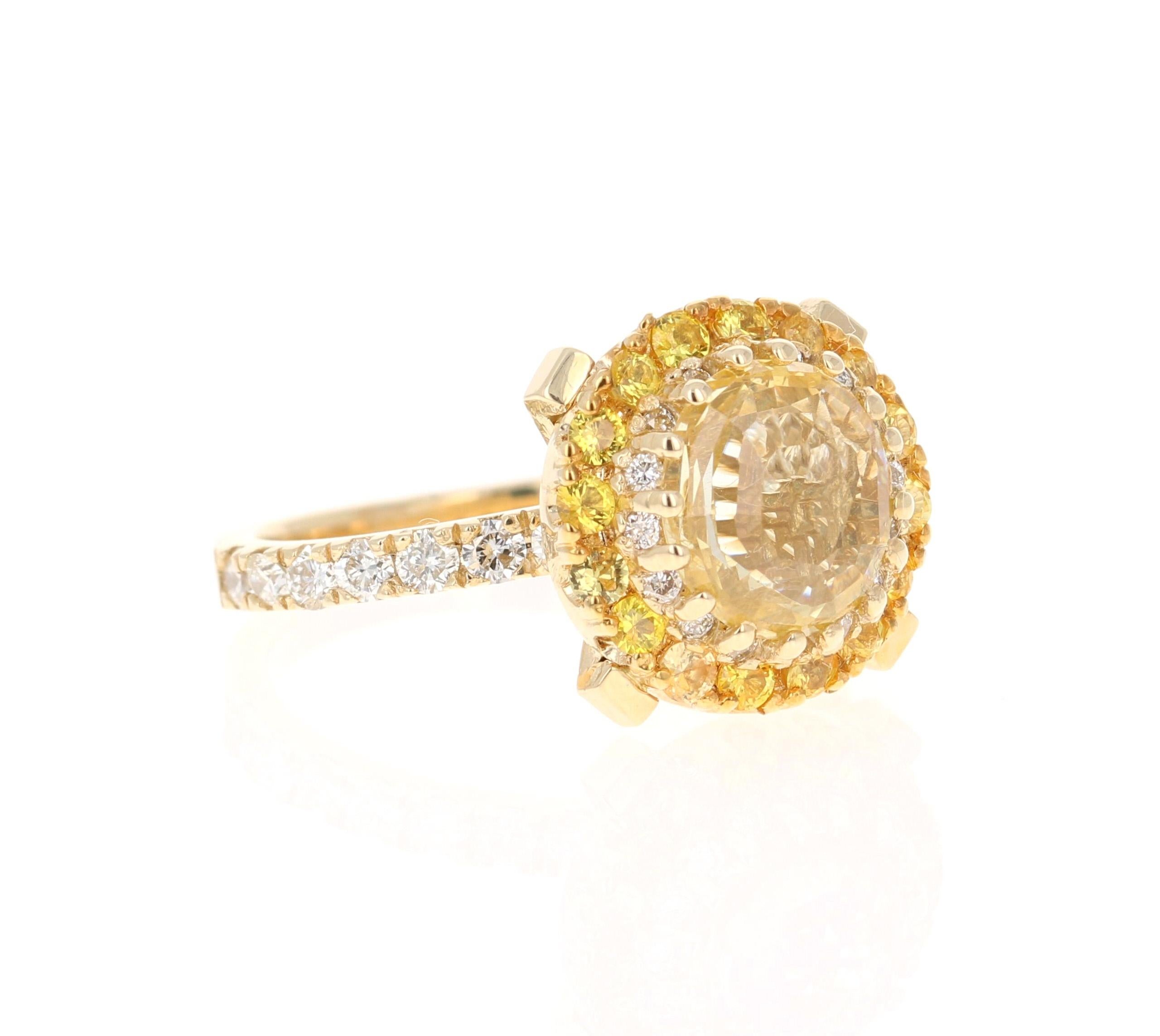 This ring has a Round Oval Cut Yellow Sapphire that is GIA Certified. The Yellow Sapphire is natural and is a NON-HEATED stone. The measurements are approximately 9 mm x 8 mm.

It is surrounded by a halo of 16 Round Cut Yellow Sapphires that weigh