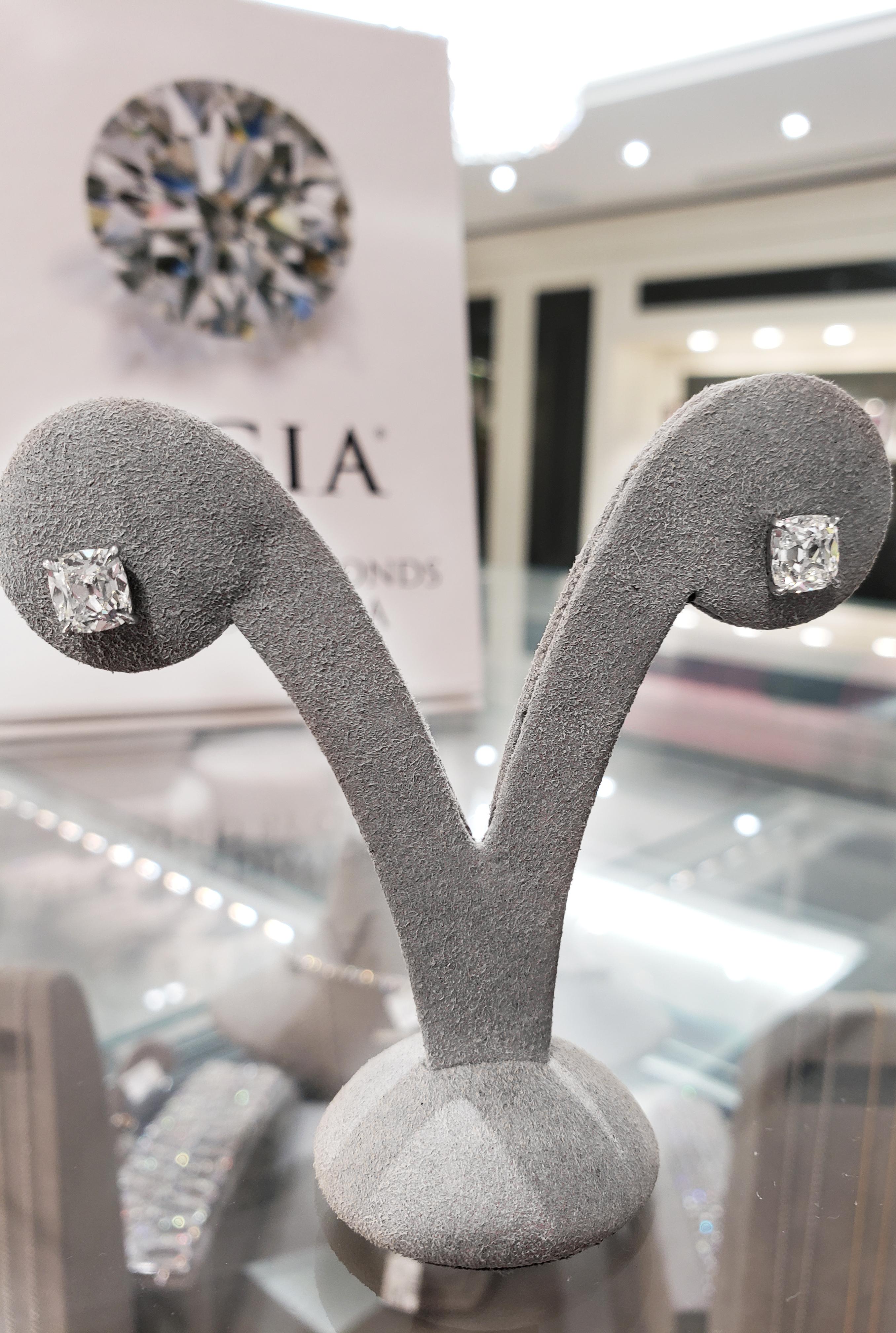 An antique-looking stud earrings showcasing 2 old mine brilliant diamonds weighing 1.22 and 1.26 carats respectively. GIA certified the diamonds as both I color, SI1 clarity. Each diamond is set in a 4 prong platinum basket.

Style available in