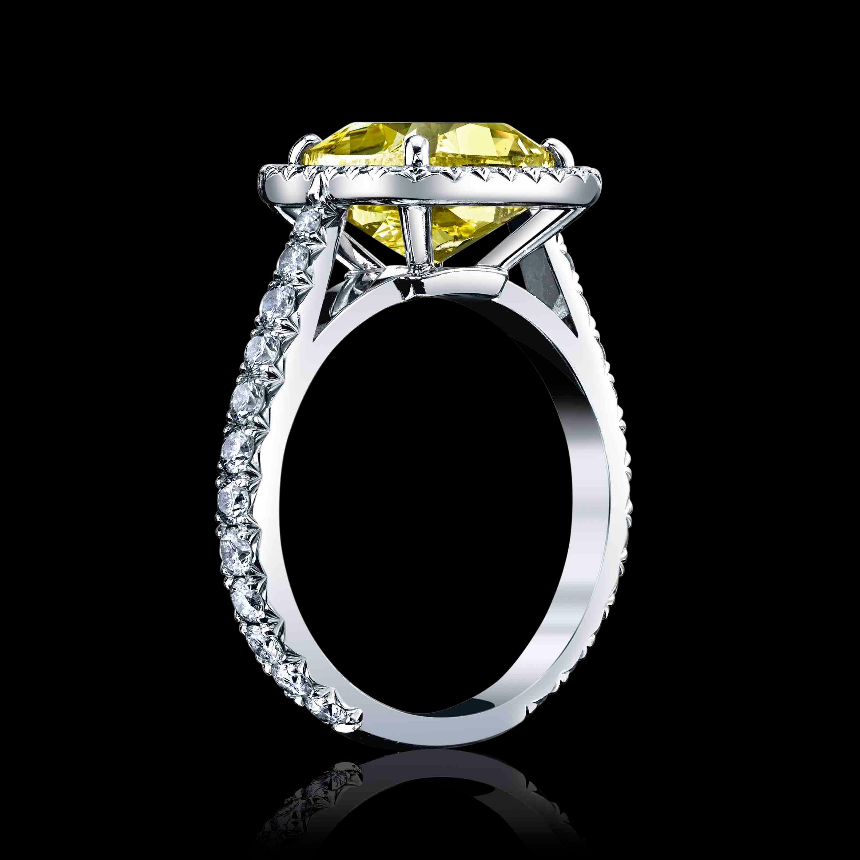 This is an original Cartier Ring with a Natural 3.02ct, Cushion Diamond, Fancy Intense Yellow, VS1 Clarity.
The Center diamond is set in Platinum with 1.00cttw melle diamonds with DE colors and VVS clarity.
The center diamond is  GIA certified