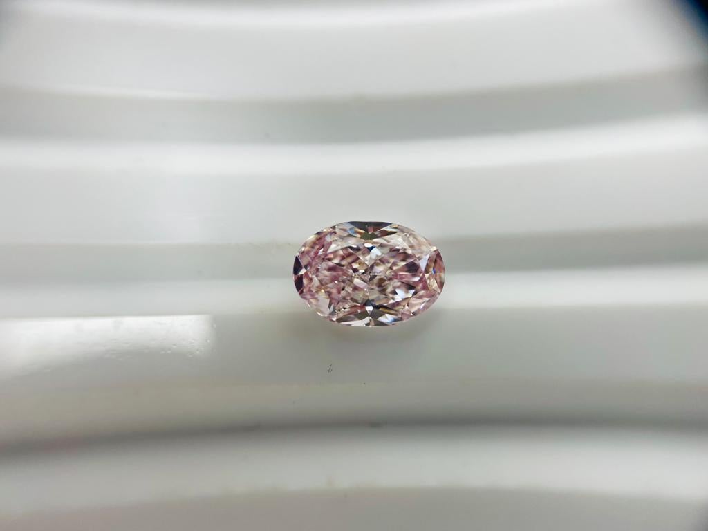 Modern GIA Certified Oval 1.03 Carat Natural Loose Fancy Light Pink VS1 Diamond For Sale