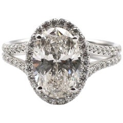 GIA Certified Oval 2.60 Carat J VVS1 Diamond Gold Split Shank Halo Ring