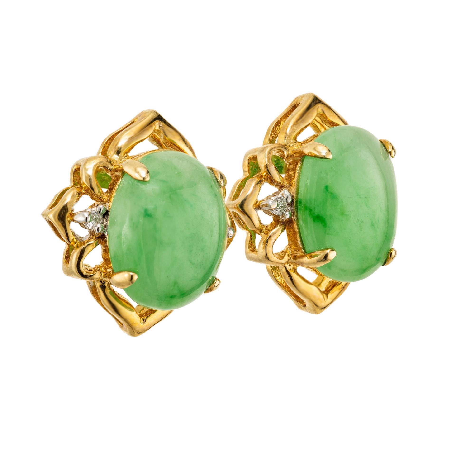 Embrace the elegance of GIA certified oval jadeite jade diamond gold earrings, an exquisite blend of opulence and 1950's craftsmanship. Each earring features one oval cabochon jadeite jade, its rich green hue accentuated by tow glistening side