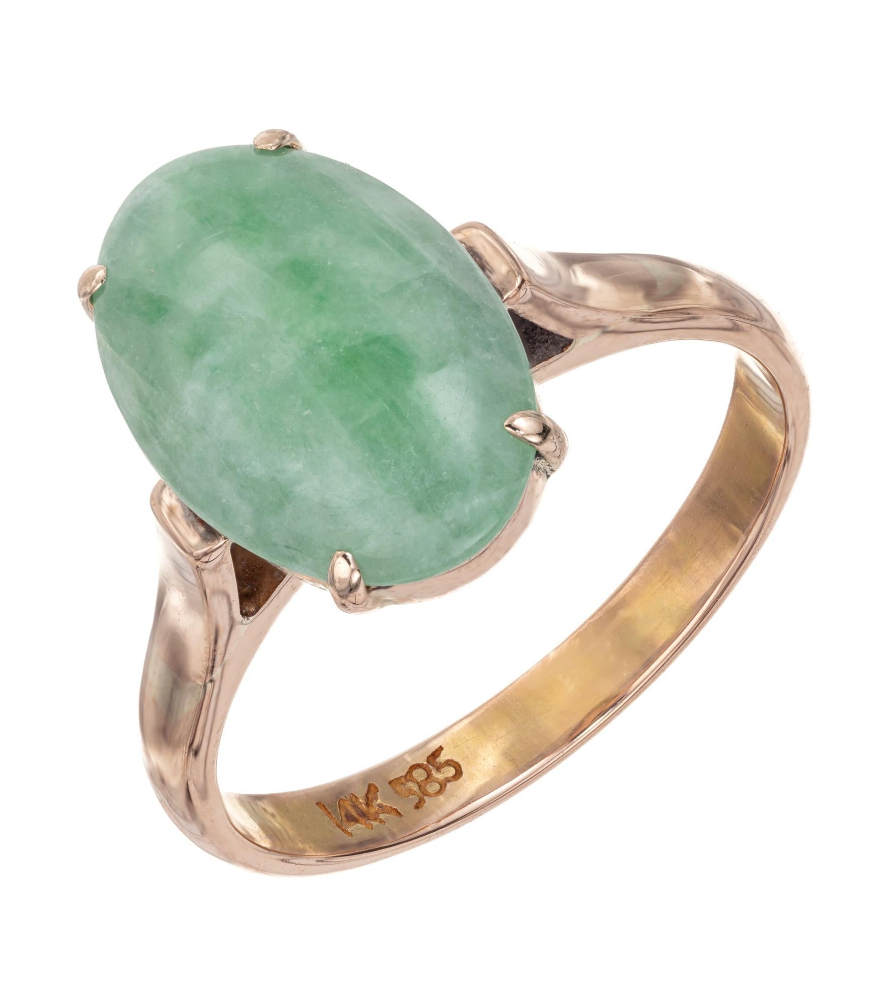 1960's Mid-Century Jadeite Jade ring. Oval cabochon jadeite jade set in a 14k rose gold four prong setting. GIA certified ad natural color, no indications of impregnation.

Follow us on our 1stdibs storefront to view our weekly new additions and 5