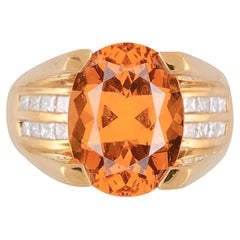 Bague en grenat spessartine orange mandarin taille ovale de 13,5 carats certifié par le GIA 