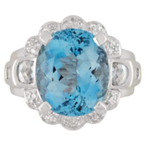 GIA Certified Oval Cut 9.5 Carat Aquamarine Ring, elegantly crafted in 18K White Gold. Adorned with 42 round cut diamond sides on the halo, 2 checkerboard cut diamond side stones, and 8 baguettes on the shank. Diamonds totaling 1.80 CTTW.

This ring