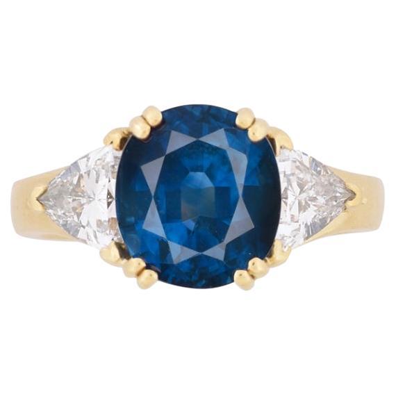 GIA Certified Oval Cut Blue Sapphire and Trillion Cut Diamond 3 Stone 18k Ring  For Sale