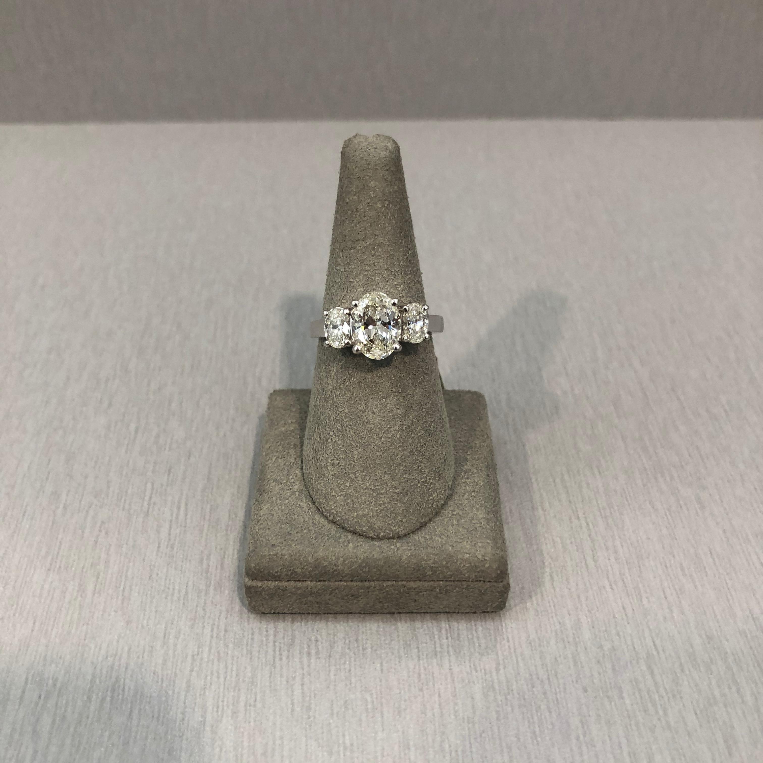 GIA Certified Oval Cut Diamond Platinum Three-Stone Engagement Ring In New Condition In New York, NY