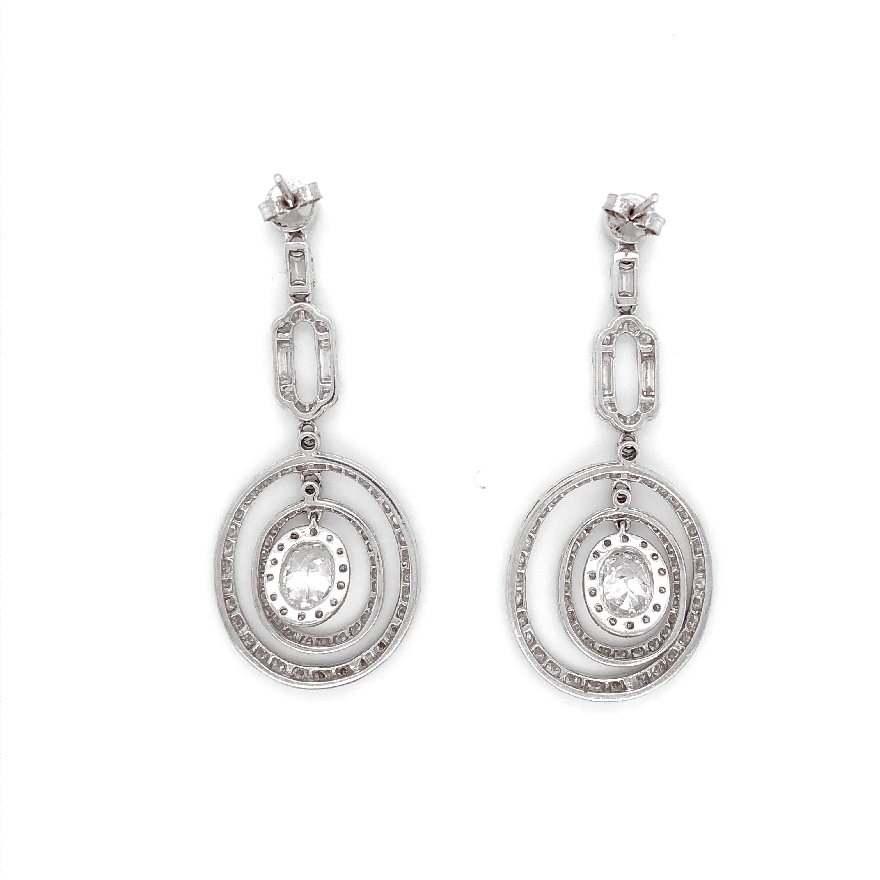GIA Certified Oval Cut Diamonds 2.02 Carat Dangling Platinum Earrings In New Condition For Sale In New York, NY
