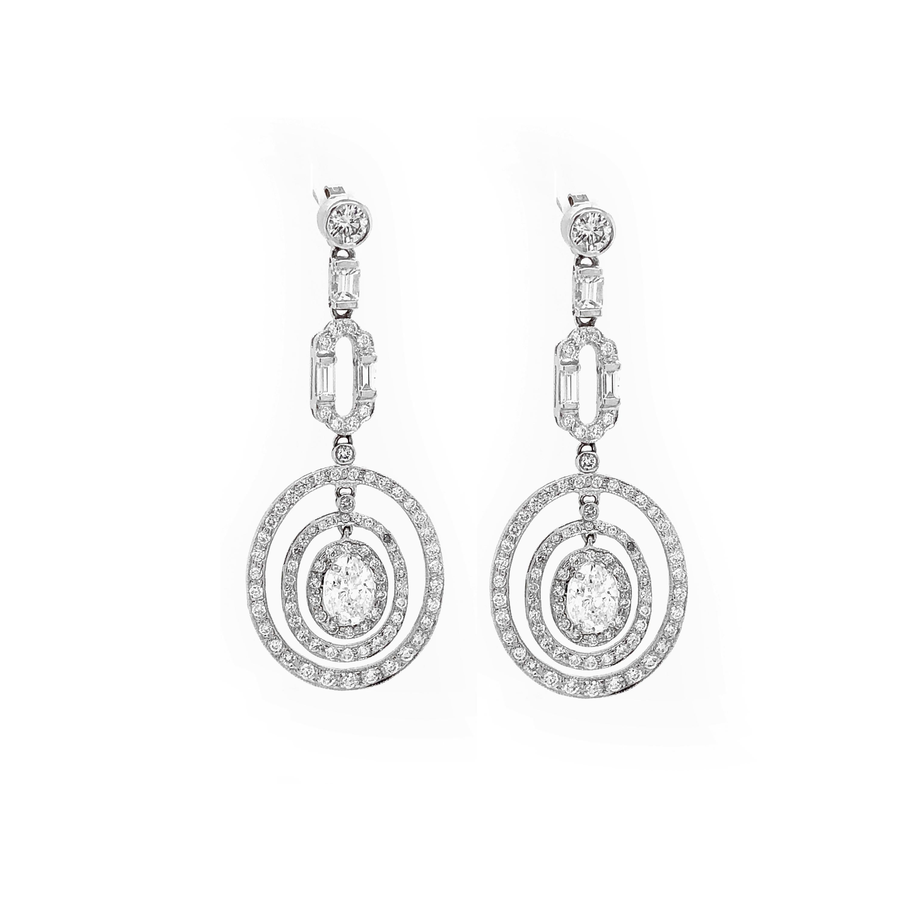 Women's GIA Certified Oval Cut Diamonds 2.02 Carat Dangling Platinum Earrings For Sale