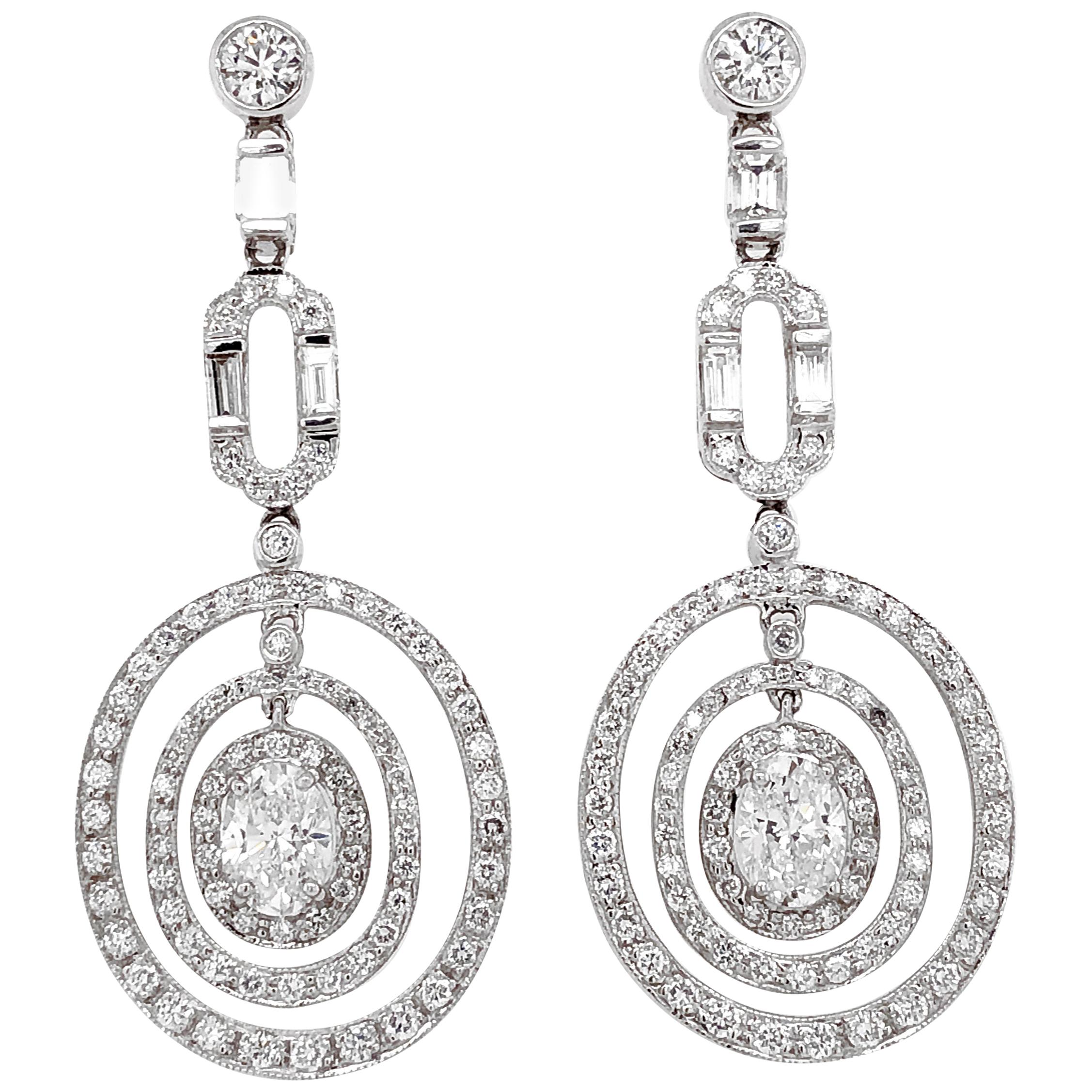 GIA Certified Oval Cut Diamonds 2.02 Carat Dangling Platinum Earrings For Sale