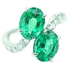 GIA Certified Oval Cut Emerald and Diamond Bypass Ring