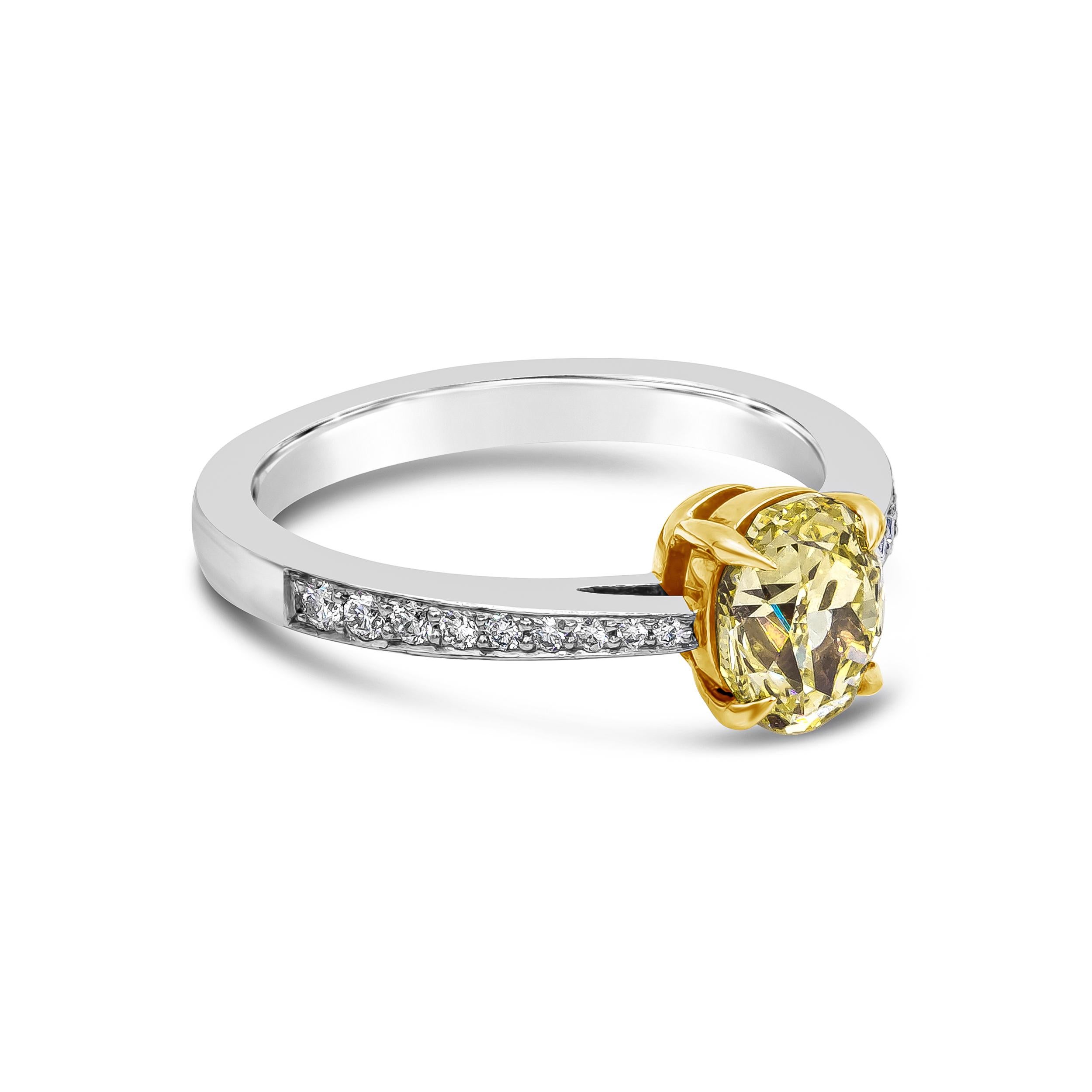 A classic and timeless engagement ring style showcasing a 1.24 carat oval cut yellow diamond, certified by GIA as Fancy Yellow color, SI1 clarity. Set in a tapered platinum mounting accented with round brilliant diamonds. Size 6 US (Sizable upon