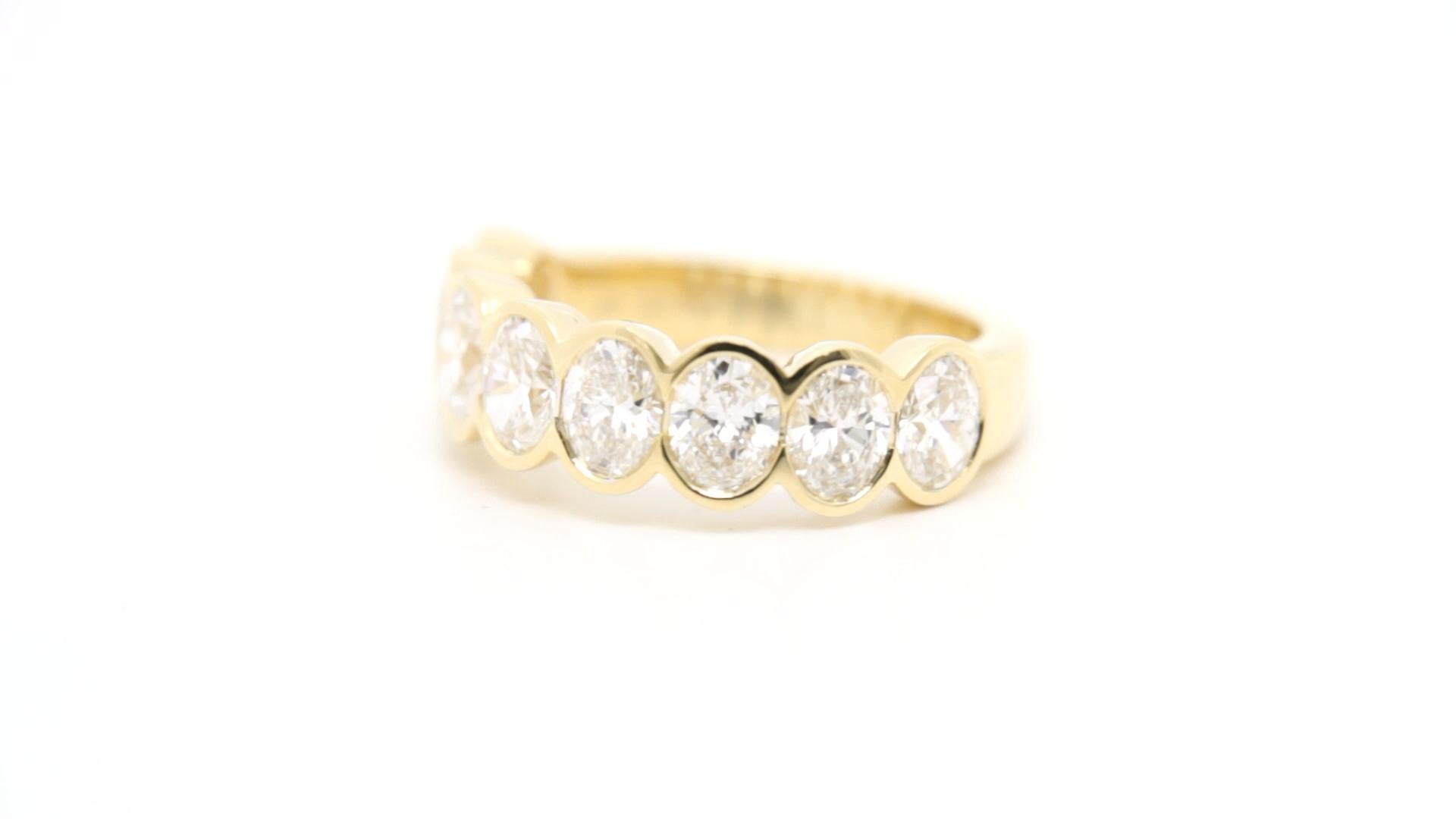 Sculpted Elegance in Every Curve

Crafted for those who appreciate refined details, this half band showcases a stunning lineup of bezel-set oval diamonds, totaling 2.48 carats. Set in rich 18K yellow gold, each stone is hand-selected for its