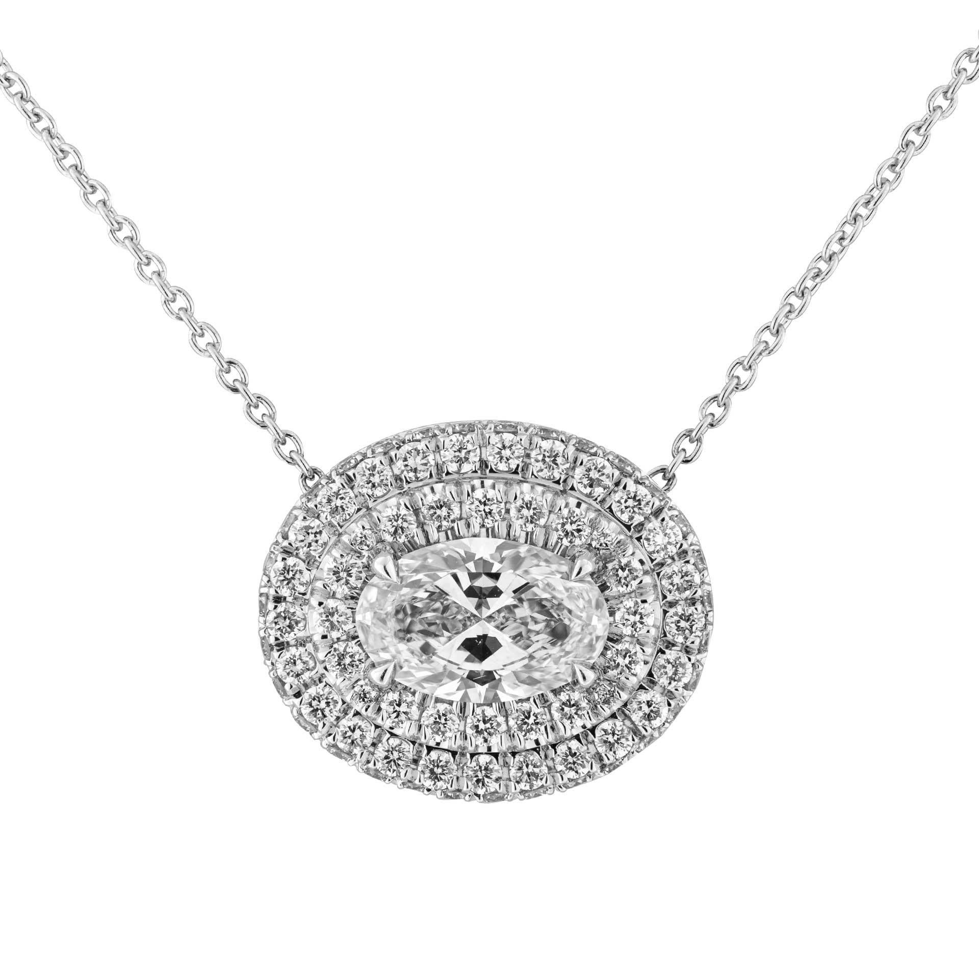 A timeless classic !
Beautiful Oval Diamond Pendant with 2 rows of white diamond halo around to highlight the beauty of the stone, totaling 0.57ct of full brilliant cut round diamonds mounted in Platinum950 

Center stone:  a 0.80ct G VS2 Oval Shape
