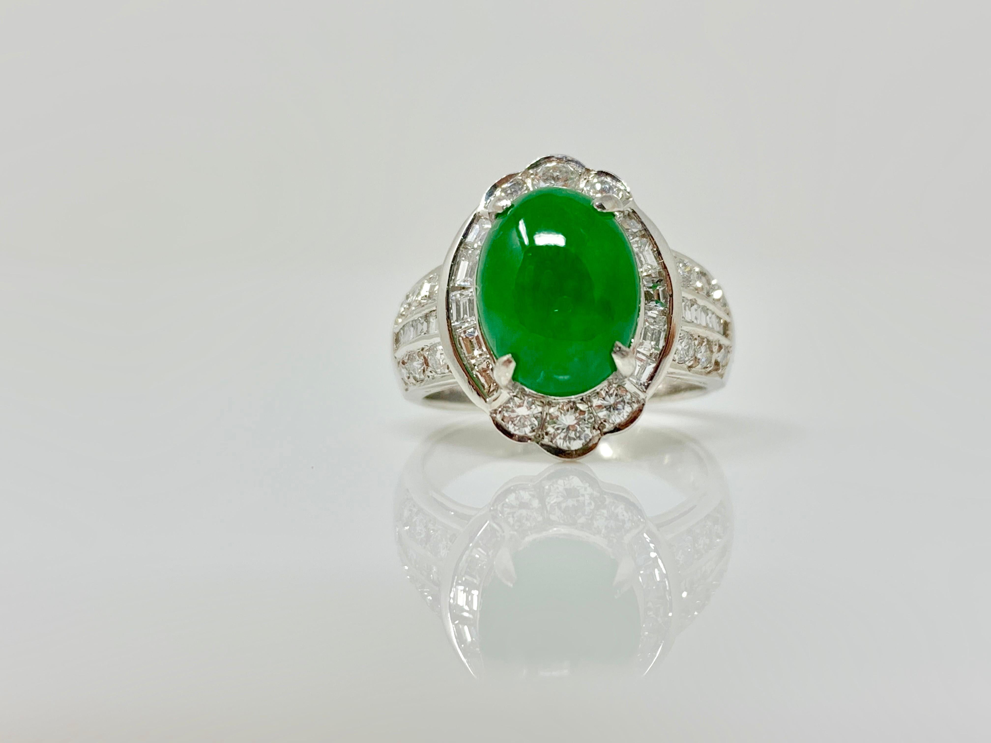 This classic and elegant ring by Moguldiam Inc is custom hand made in platinum. 

GIA Certified Oval Jade Cabochon weight : 2.74 carat 
Color : Mottled Green 
White Diamond weight : 0.70 carat ( GH color and VS clarity) 
Ring Size : 4 1/2 and can be