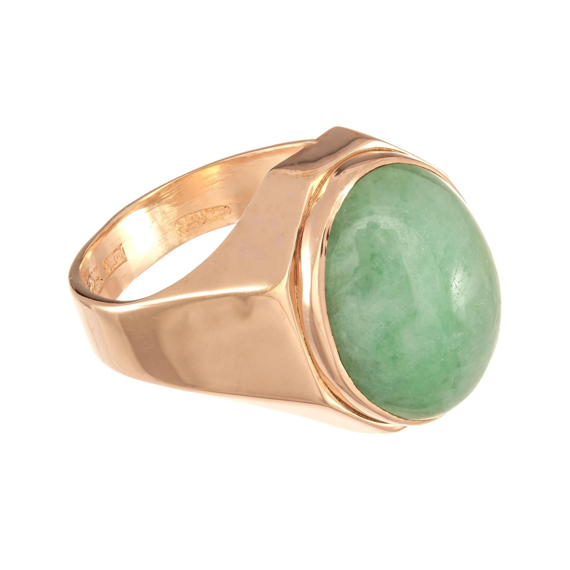 GIA certified natural untreated Jadeite unisex ring, Oval jade center stone set in 18k rose gold setting. 

1 oval cabochon mottled green Jadeite Jade GIA Certificate # 2203517929
Size 8.75 and sizable 
18k Rose Gold
Tested: 18k
10.1 grams
Width at
