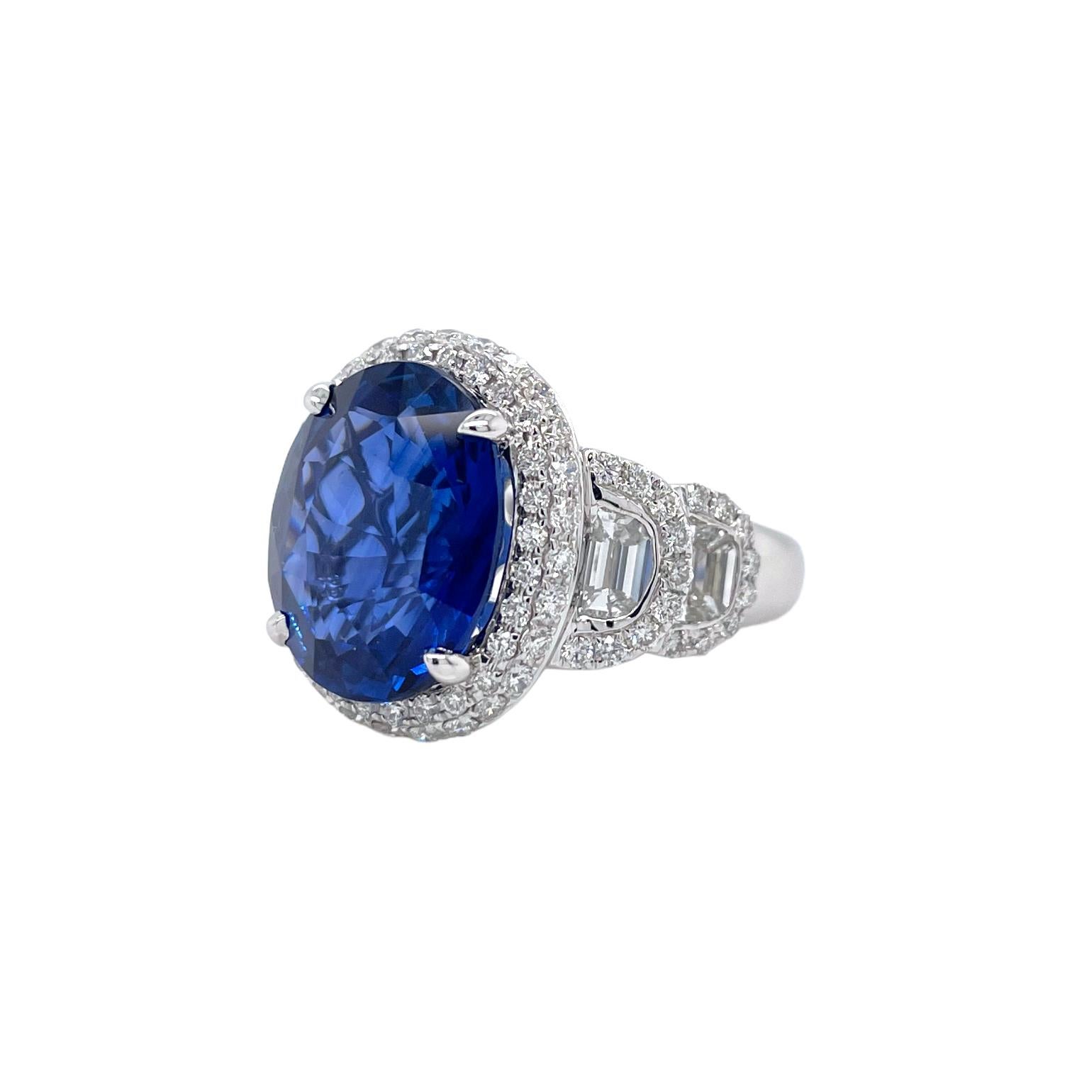 Ring contains one center oval brilliant shape sapphire 8.09ct, 4 half-moon diamonds 1.16tcw and round brilliant diamonds 0.94tcw. Center sapphire is C. Dunaigre certified, measuring 13.4x10.79mm. All diamonds are G in color and VS2 in clarity. Ring