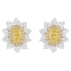 GIA Certified Oval shape Natural Fancy Yellow Diamond Earrings in 18K Gold