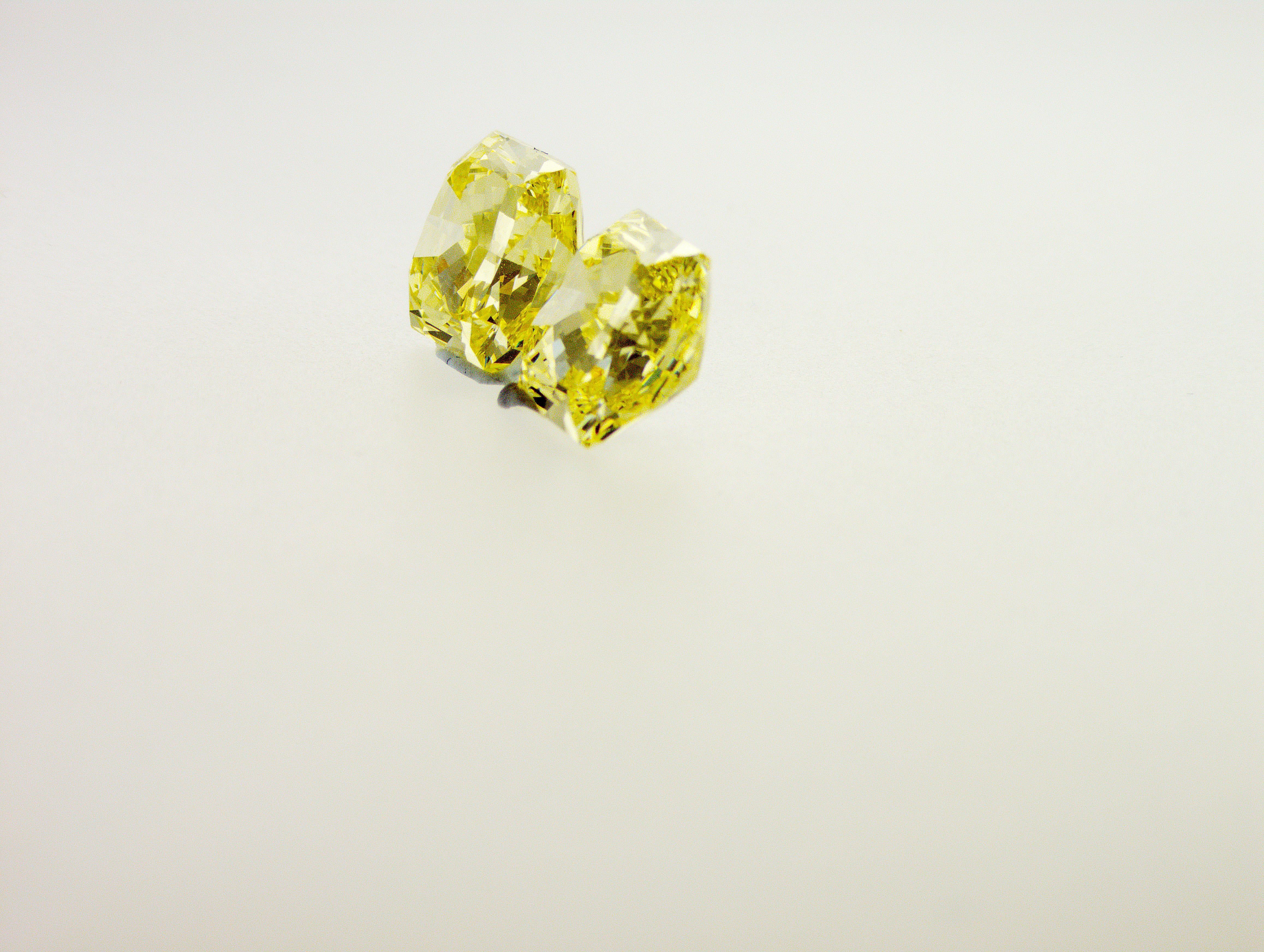 Very unique and rare pair of Fancy Intense Yellow Diamonds 3.02 and 3.07 carats. These two diamonds has been made from one rough diamond stone. 
1st diamond 8.39x7.81x5.01 mm - 3.02 ct Fancy Intense Yellow
2nd diamond 8.49x7.91x5.04 mm - 3.07 ct