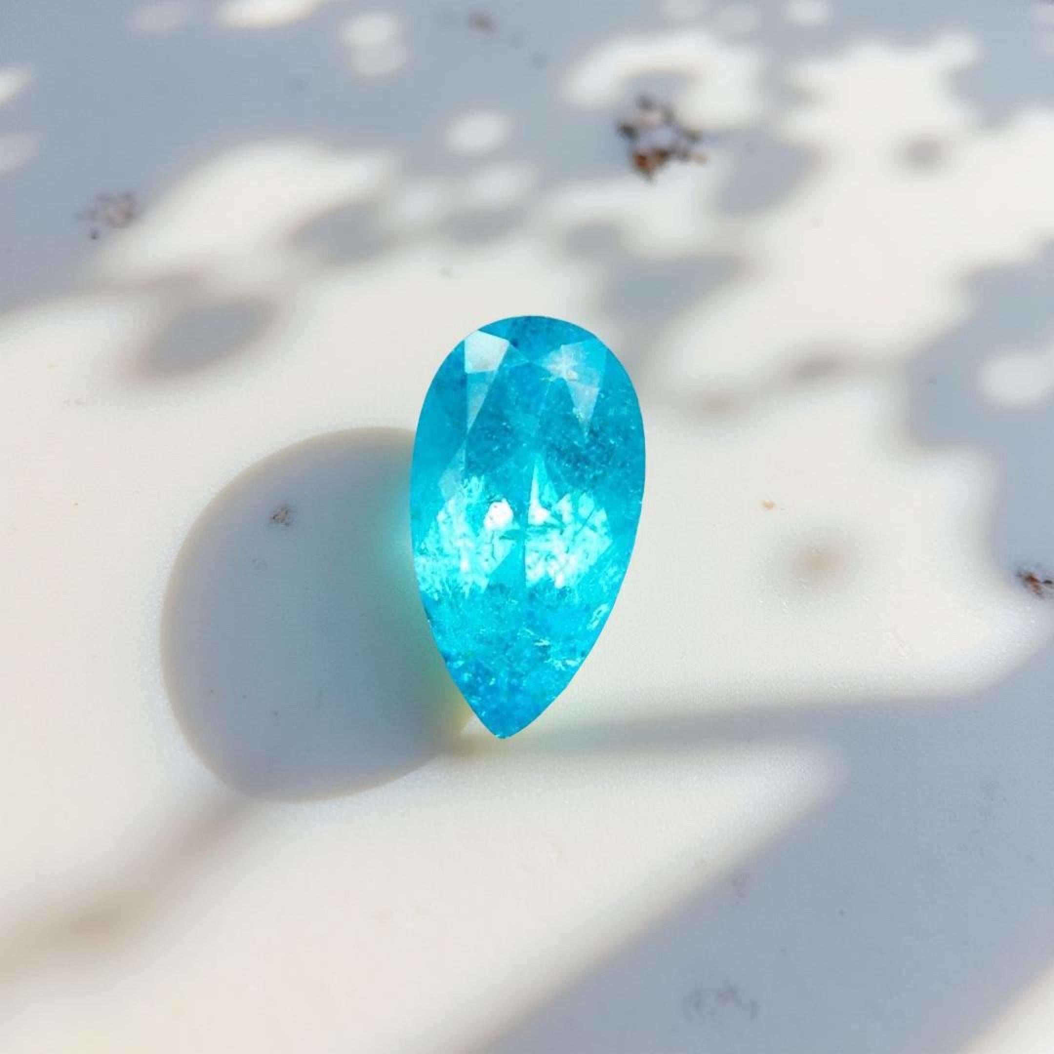 GIA CERTIFIED EXCELLENCE
• Weight: 1.41 carats
• Cut: Pear Modified Brilliant
• Origin: Brazil (GIA Certified)
• Color: Greenish Blue with neon vibrance
• Transparency: Crystal clear brilliance
• Certification: GIA Report No. 2457781939
* Custom