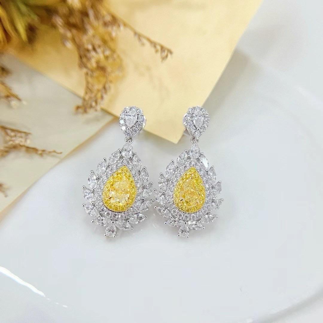 GIA Certified Pear-Cut Yellow Diamond 18K White Gold Earrings with Diamonds

2 Pear-Cut Yellow Diamonds - 1.06 CT
GIA Certification - 
Fancy Yellow Color; 
Pear Modified Brilliant Cut

Diamonds - 2.14 CT
18K Gold - 5.43 GM