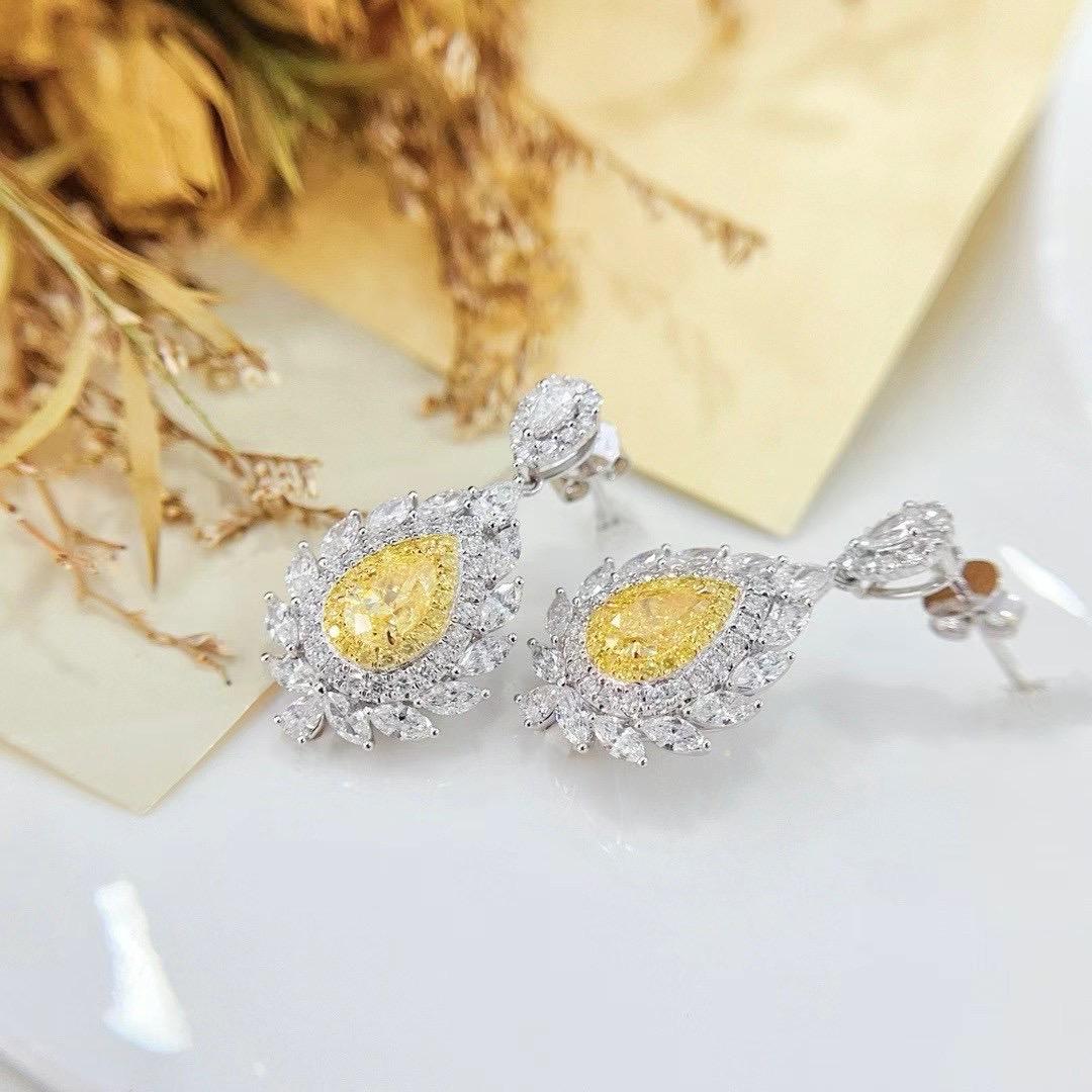 Modern GIA Certified Pear-Cut Yellow Diamond 18K White Gold Earrings with Diamonds For Sale