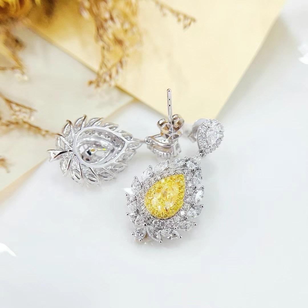 Pear Cut GIA Certified Pear-Cut Yellow Diamond 18K White Gold Earrings with Diamonds For Sale