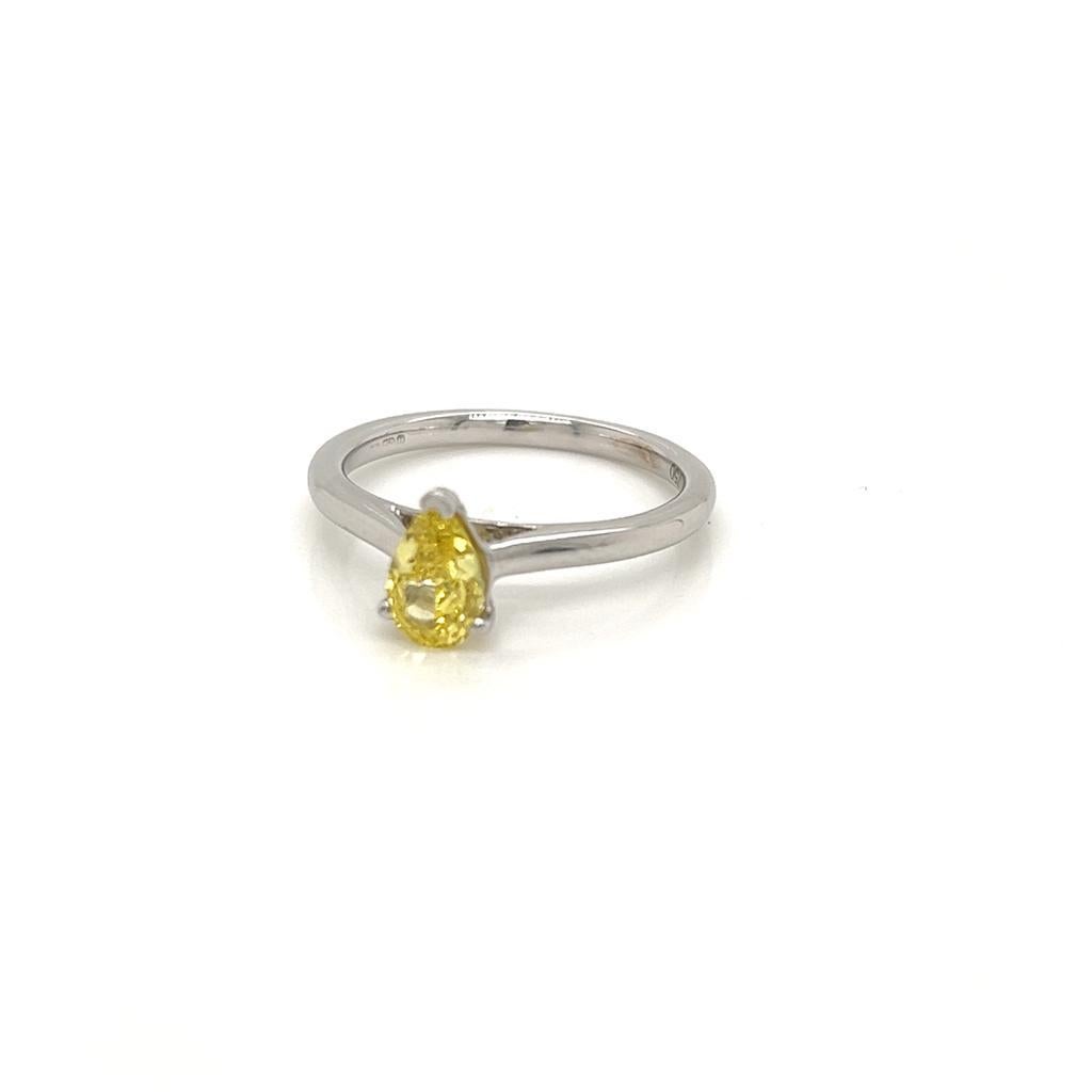 GIA Certified Pear shape 0.7 Carat Yellow Diamond Platinum Solitaire Ring

This timeless beauty features a GIA certified 0.7 carat, natural yellow Diamond at its centre. This alluring gemstone is held in a claw setting on a Platinum band.

The