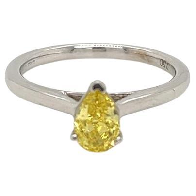 GIA Certified Pear shape 0.7 Carat Yellow Diamond Platinum Solitaire Ring