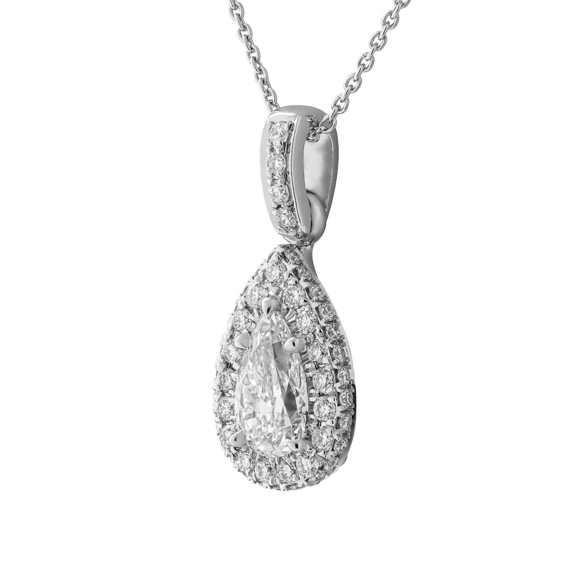 A timeless classic !
Beautiful Pear Shape Diamond Pendant with  diamond halo around to highlight the beauty of the stone, totaling 0.45ct of full brilliant cut round diamonds mounted in Platinum950 
Center stone:  0.83ct H VS2 Pear GIA#2387336534