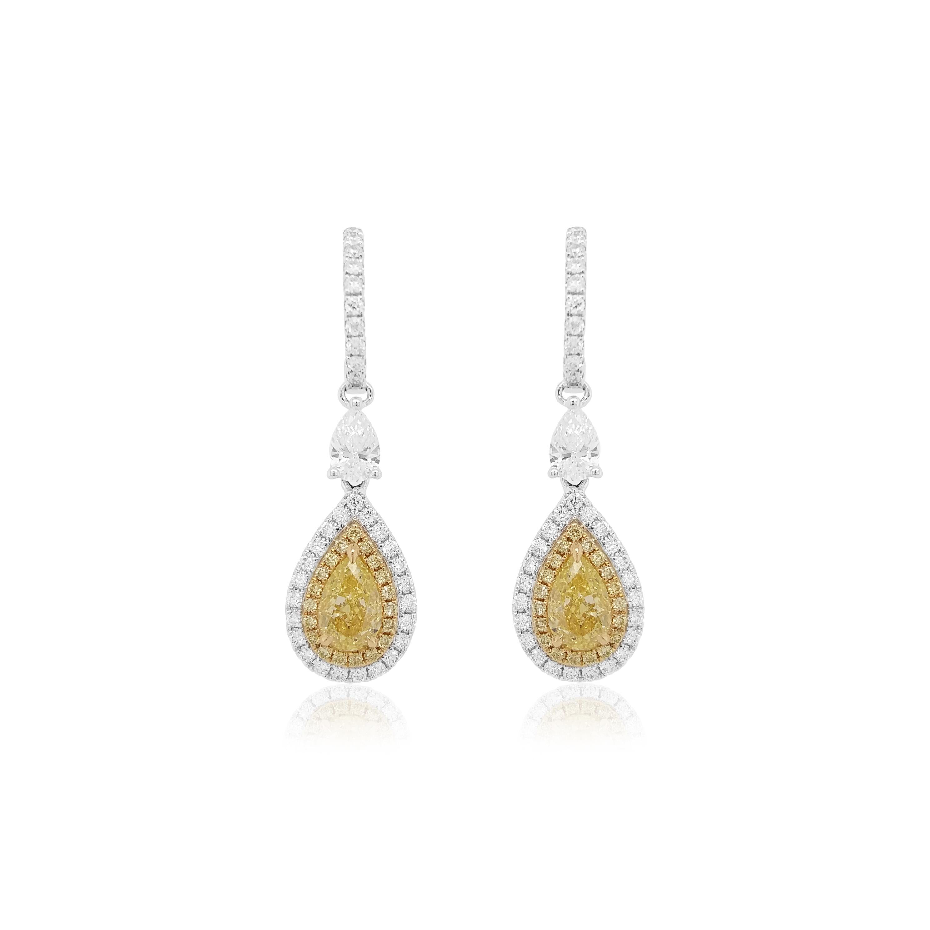 Embrace the Festive Spirit with Timeless Luxury! Beautiful dangling yellow diamond earrings, in a rare Pear shape, set in 18K gold.

NATURAL FANCY YELLOW DIAMOND- 1.02 ct GIA CERTIFIED 
NATURAL YELLOW DIAMOND-0.24CT
NATURAL WHITE DIAMOND-0.98CT
MADE